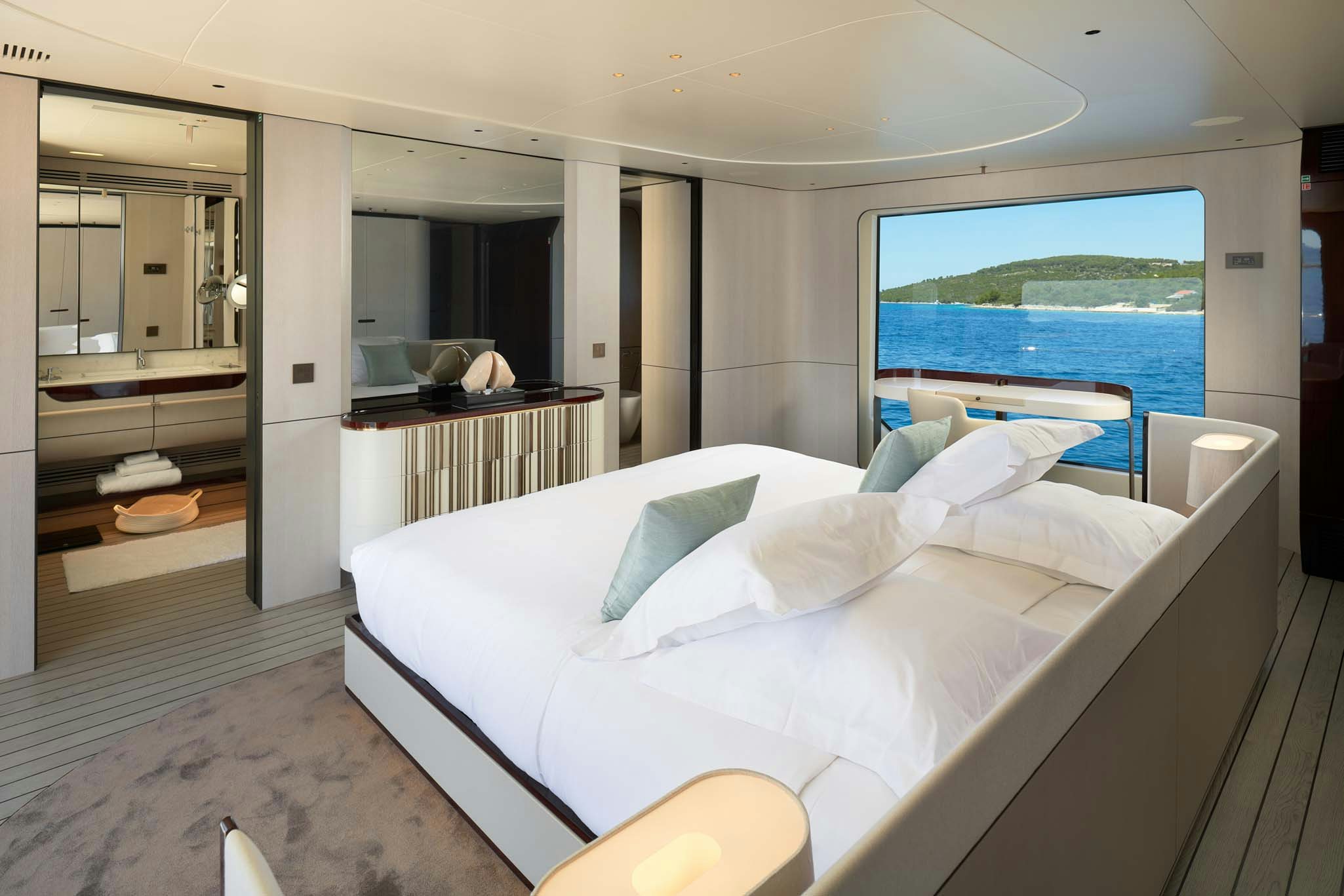 a bed in a room aboard HEED Yacht for Charter
