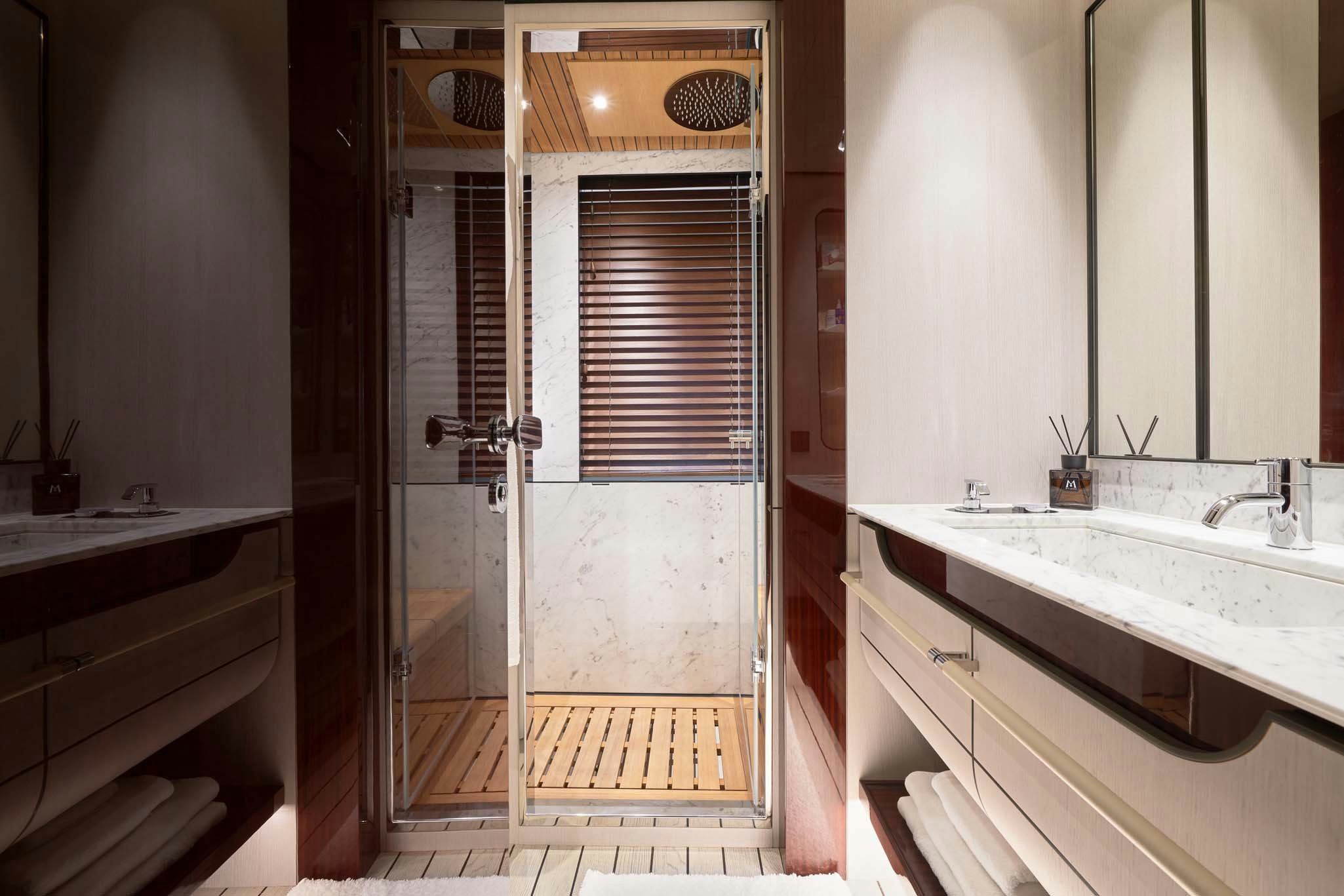 a bathroom with a sink and a shower aboard HEED Yacht for Charter