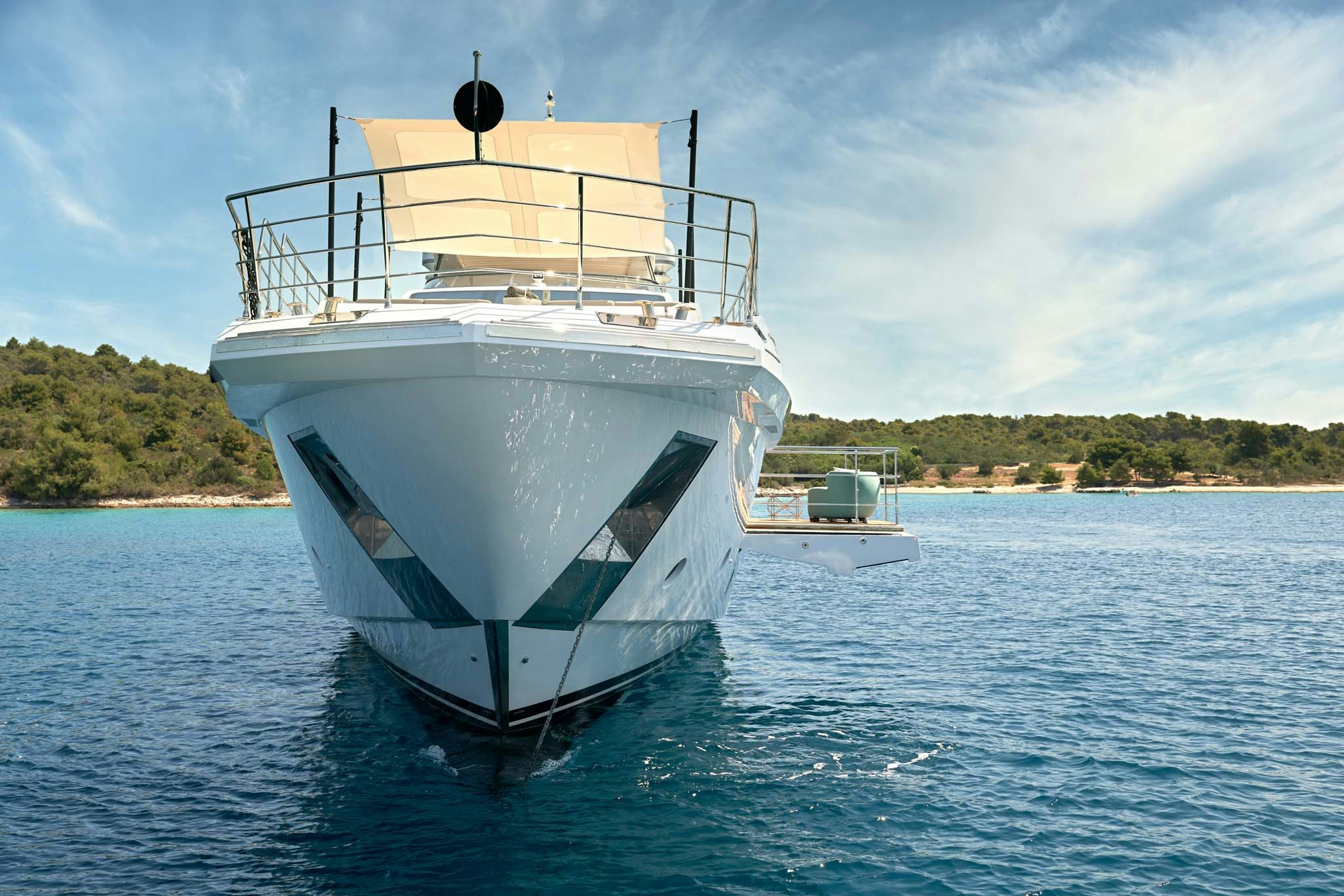 a white boat in the water aboard HEED Yacht for Charter