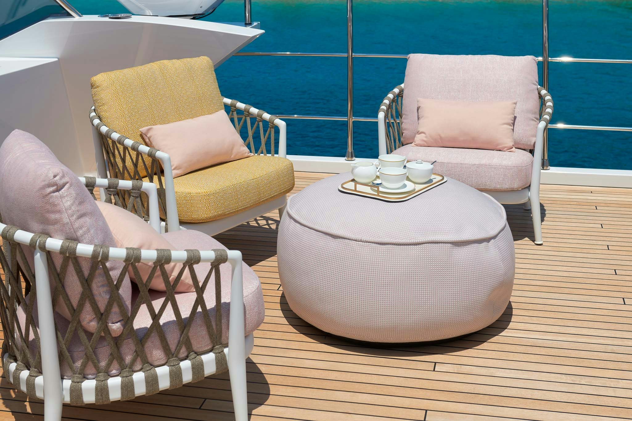 a couple of chairs by a pool aboard HEED Yacht for Charter