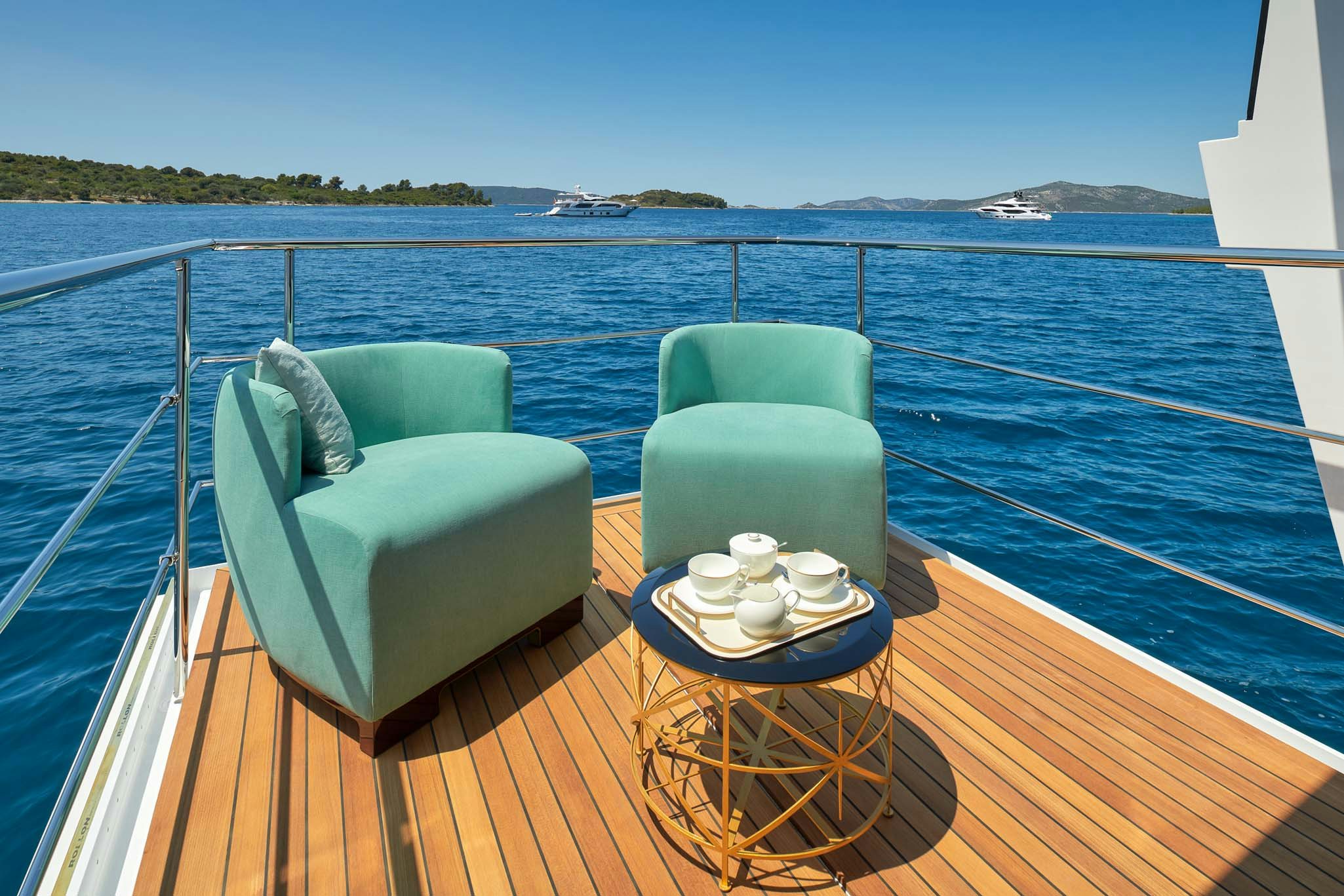 a table and chairs on a boat aboard HEED Yacht for Charter