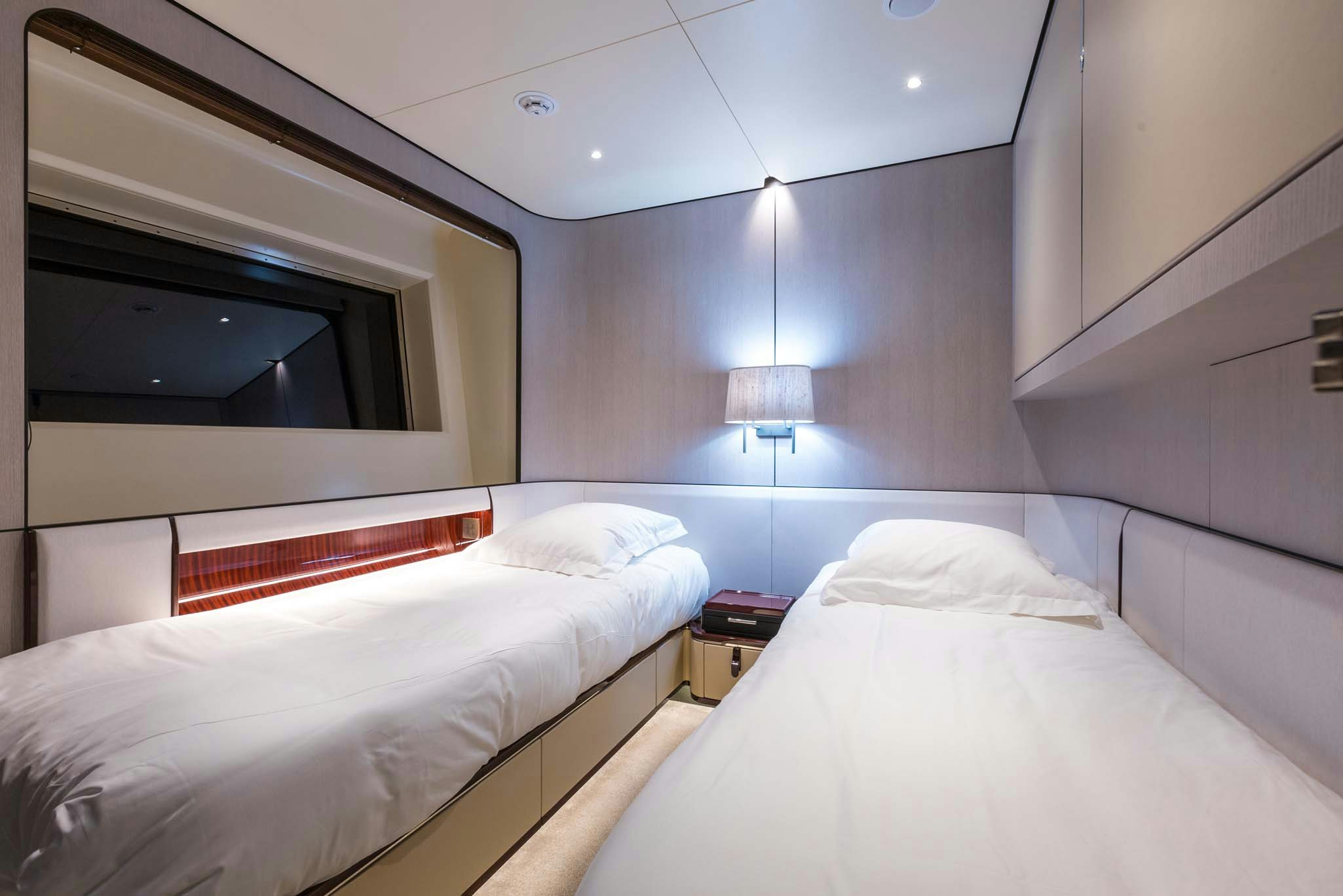 a room with two beds aboard HEED Yacht for Charter