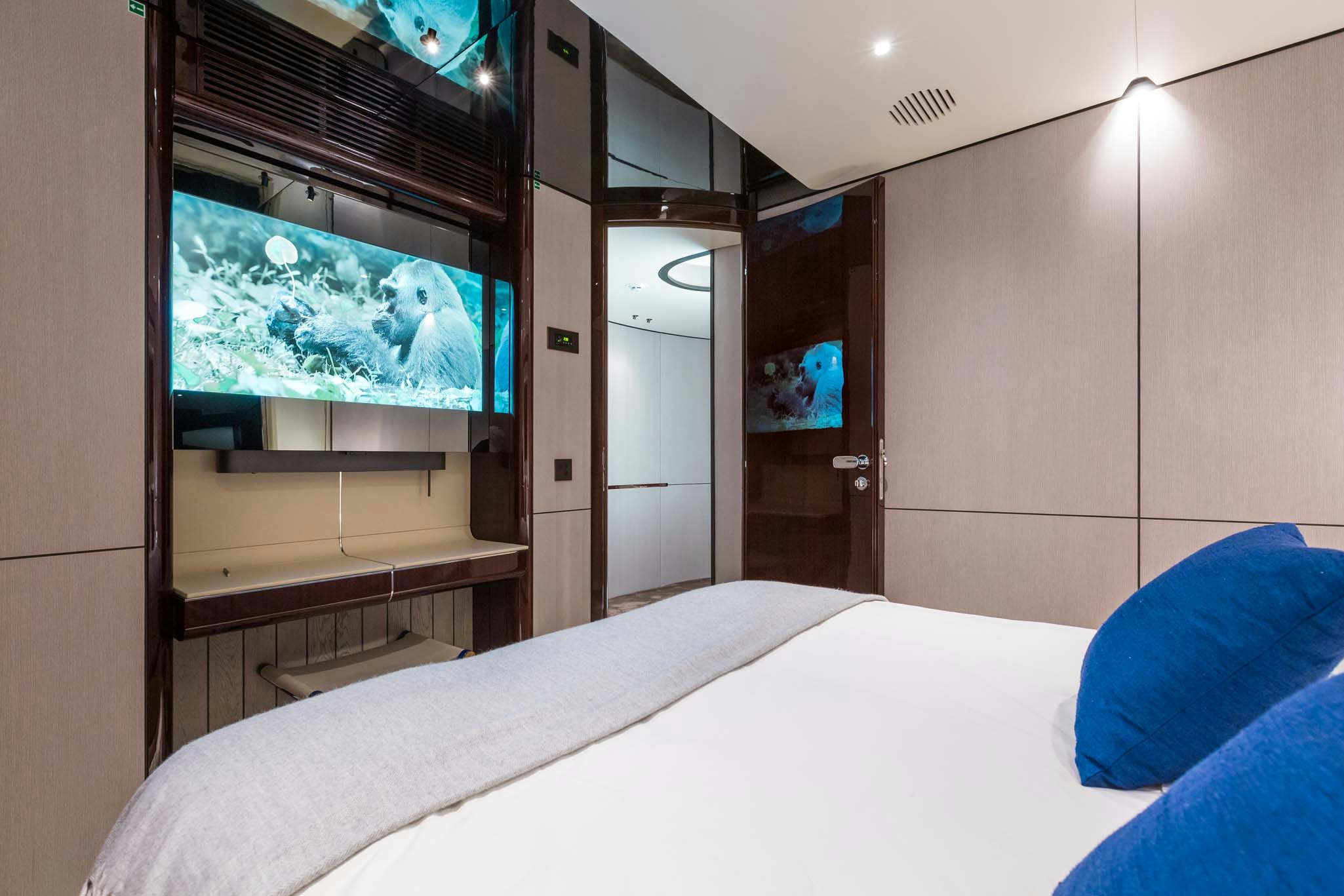 a bed in a room aboard HEED Yacht for Charter