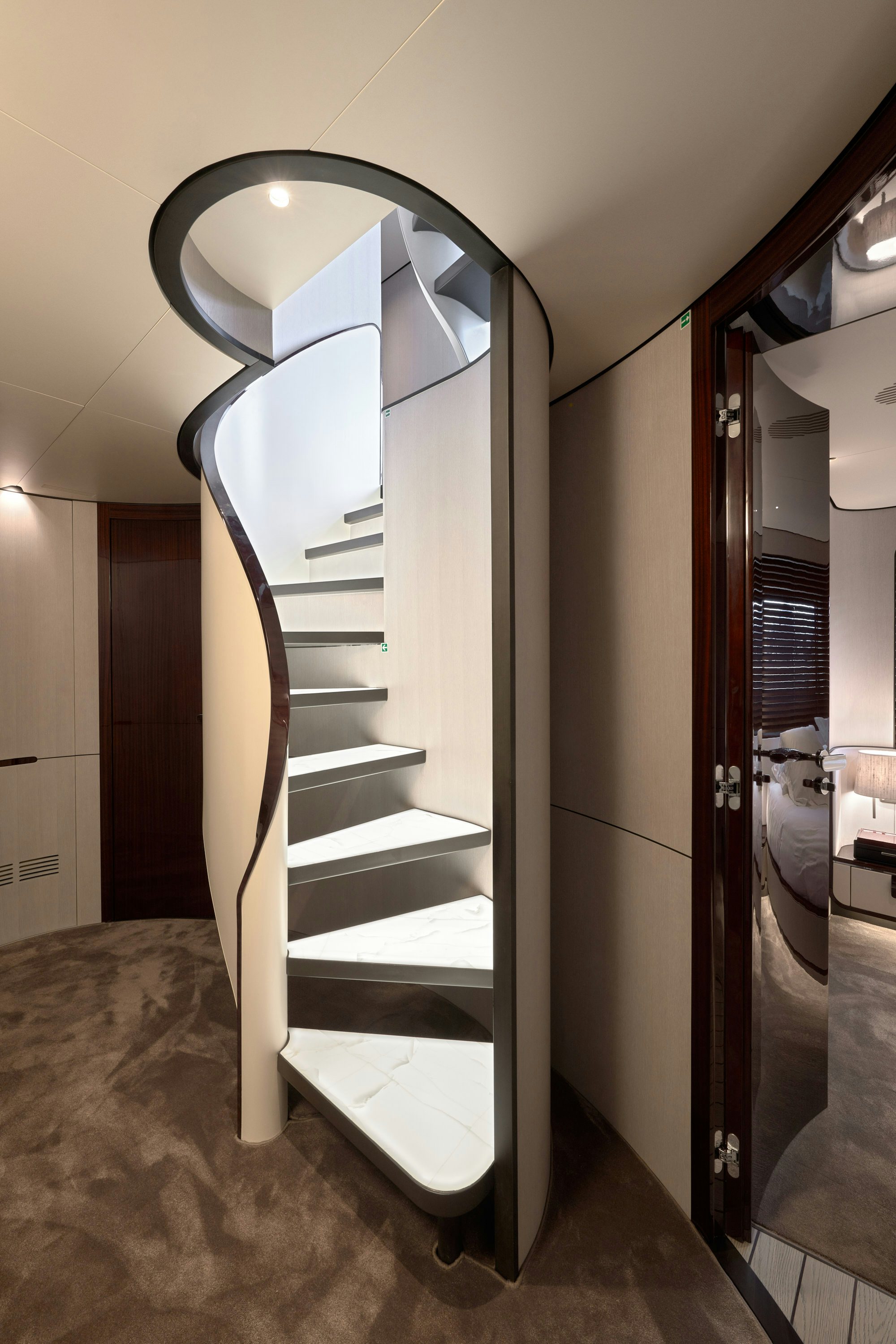 a large white staircase in a room aboard HEED Yacht for Sale