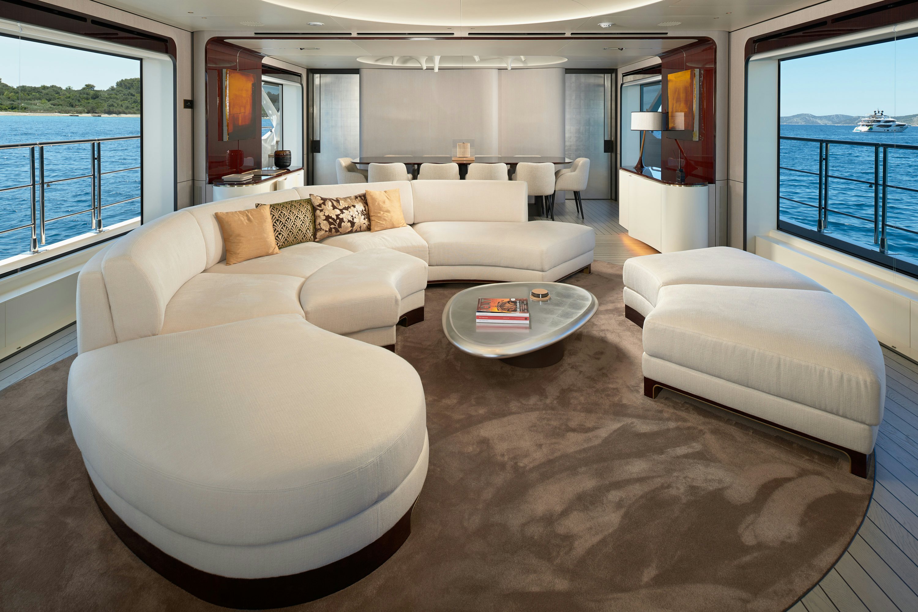 a living room with a large couch aboard HEED Yacht for Sale