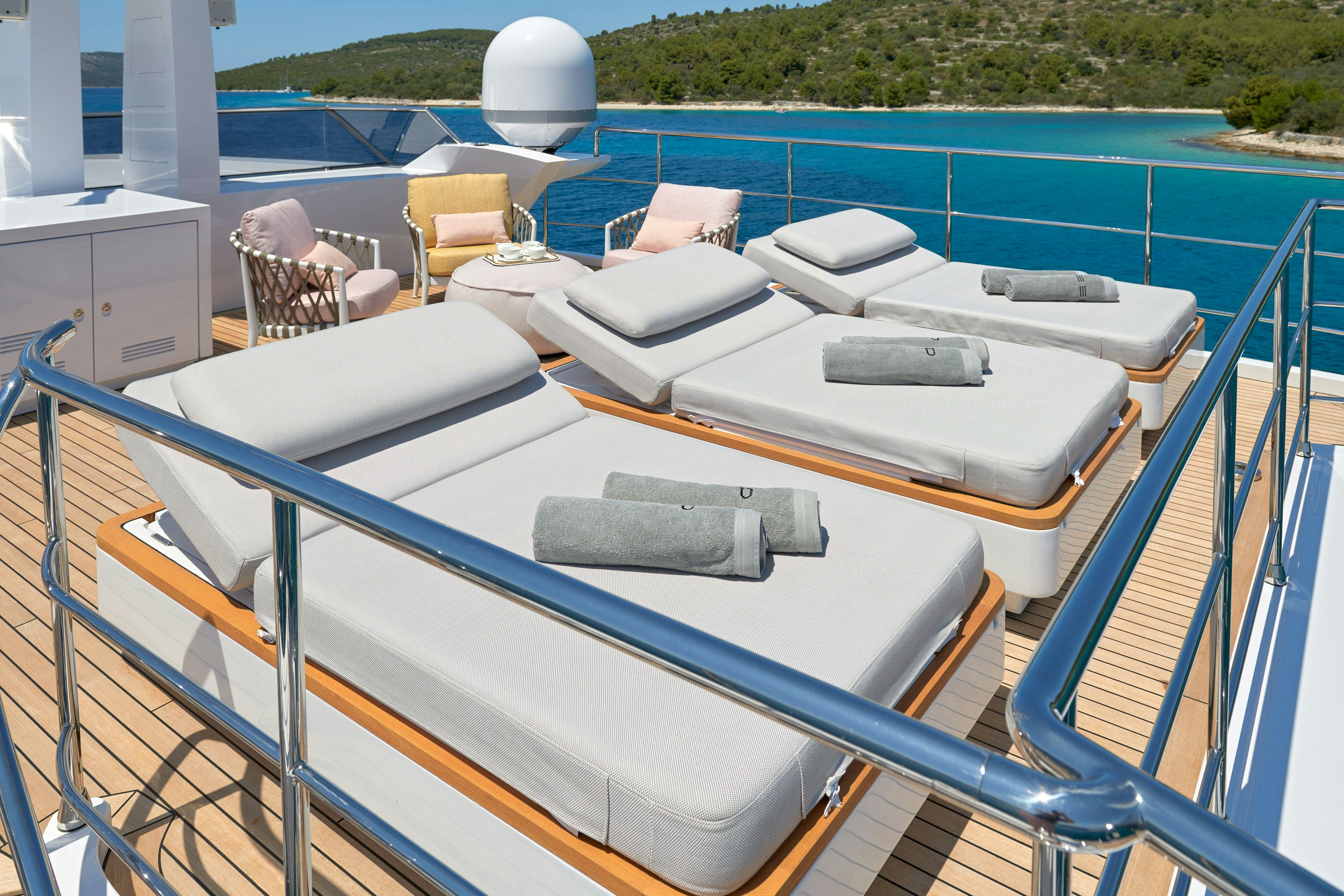 a deck with a pool and chairs aboard HEED Yacht for Sale