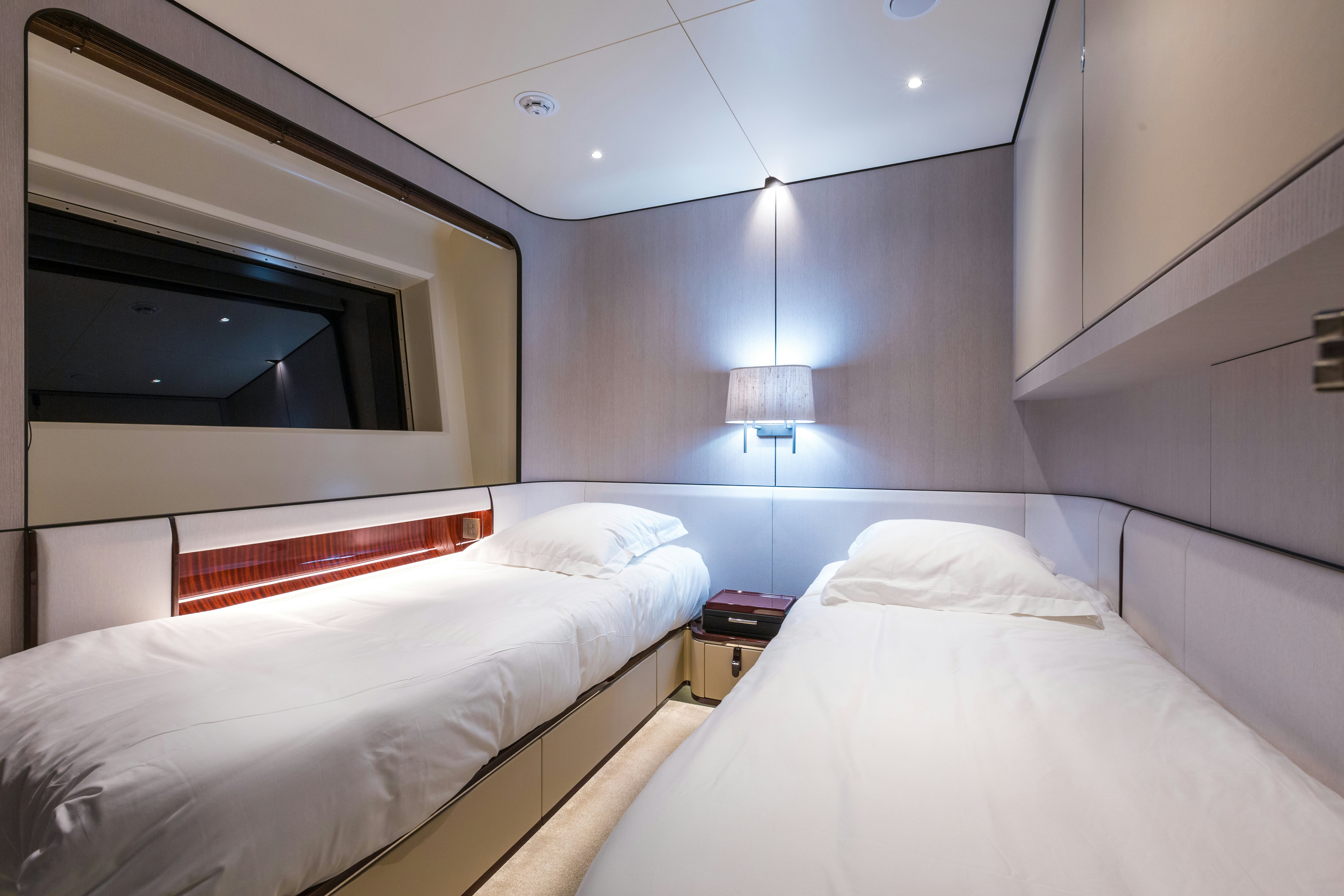 a room with two beds aboard HEED Yacht for Sale
