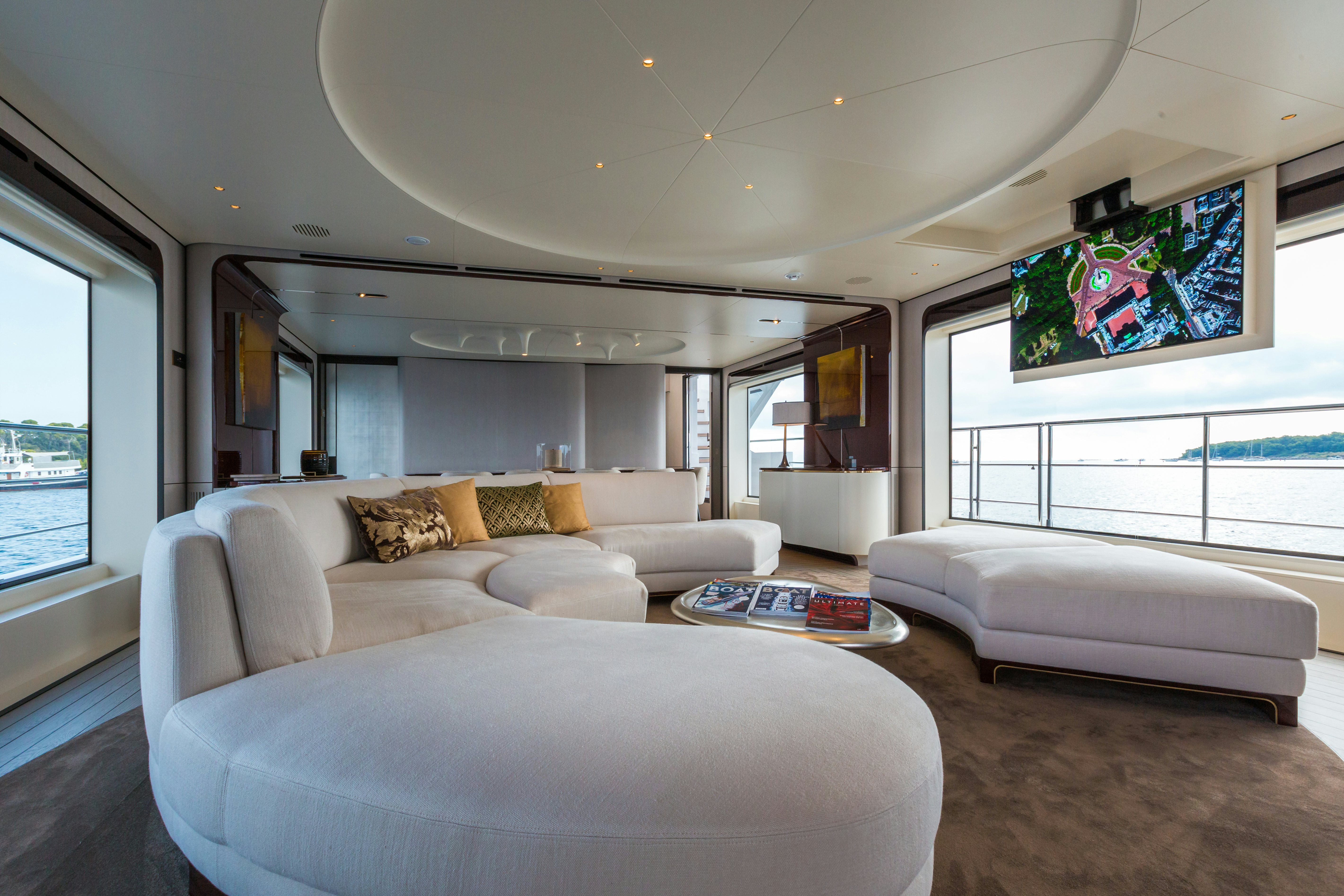 a living room with a large window aboard HEED Yacht for Sale