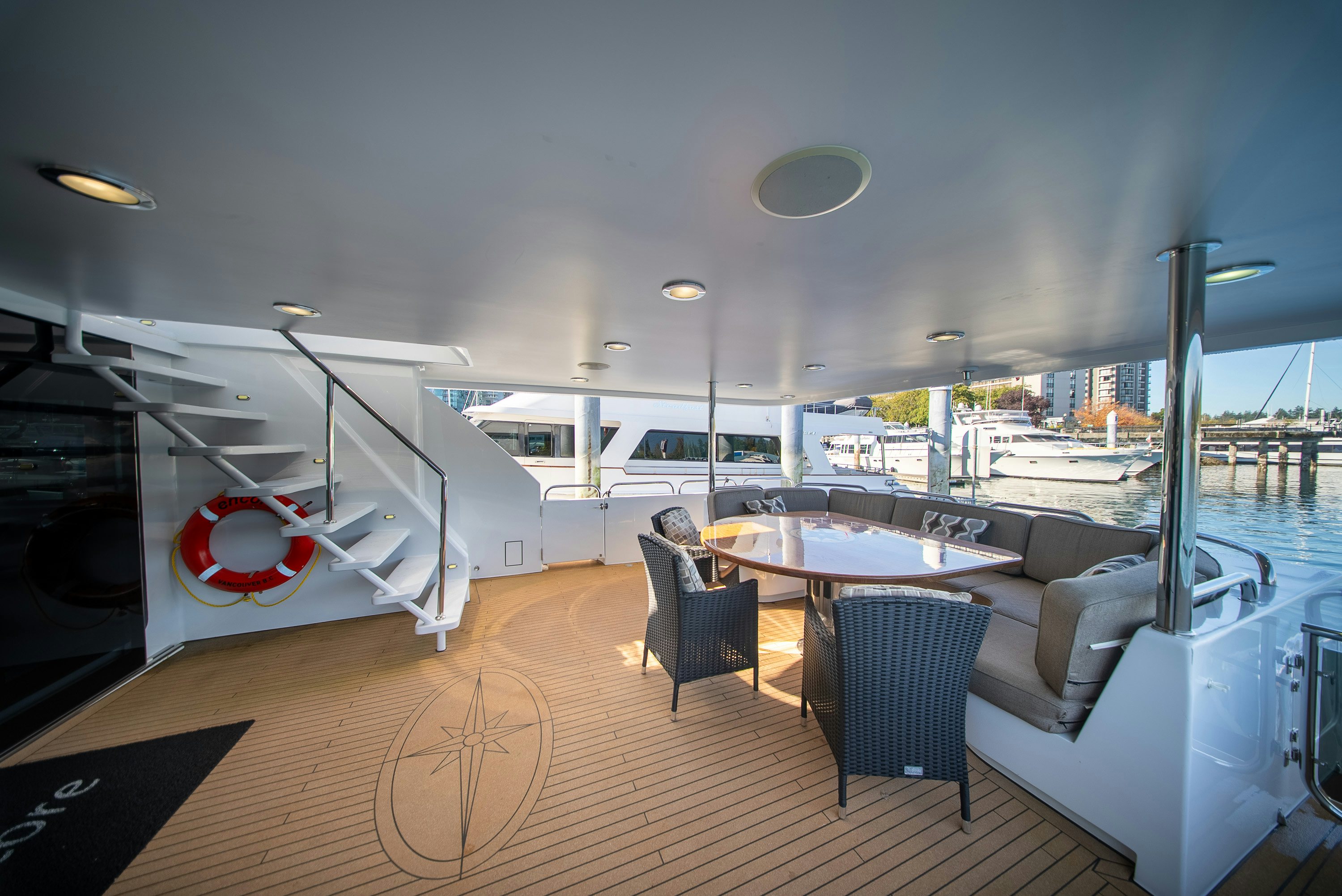 a room with a table and chairs aboard ENCORE Yacht for Sale