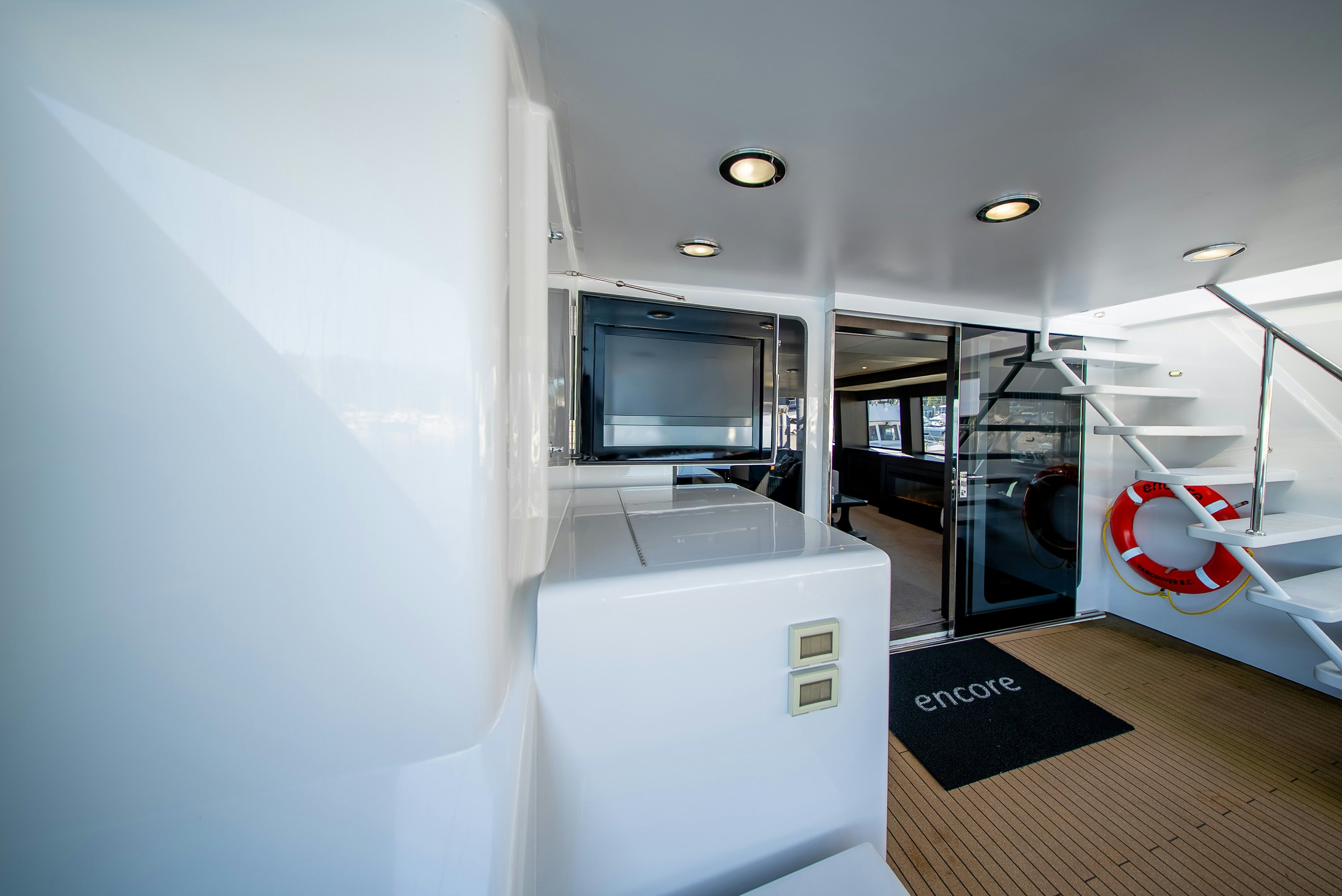 a room with a large mirror and a sink aboard ENCORE Yacht for Sale