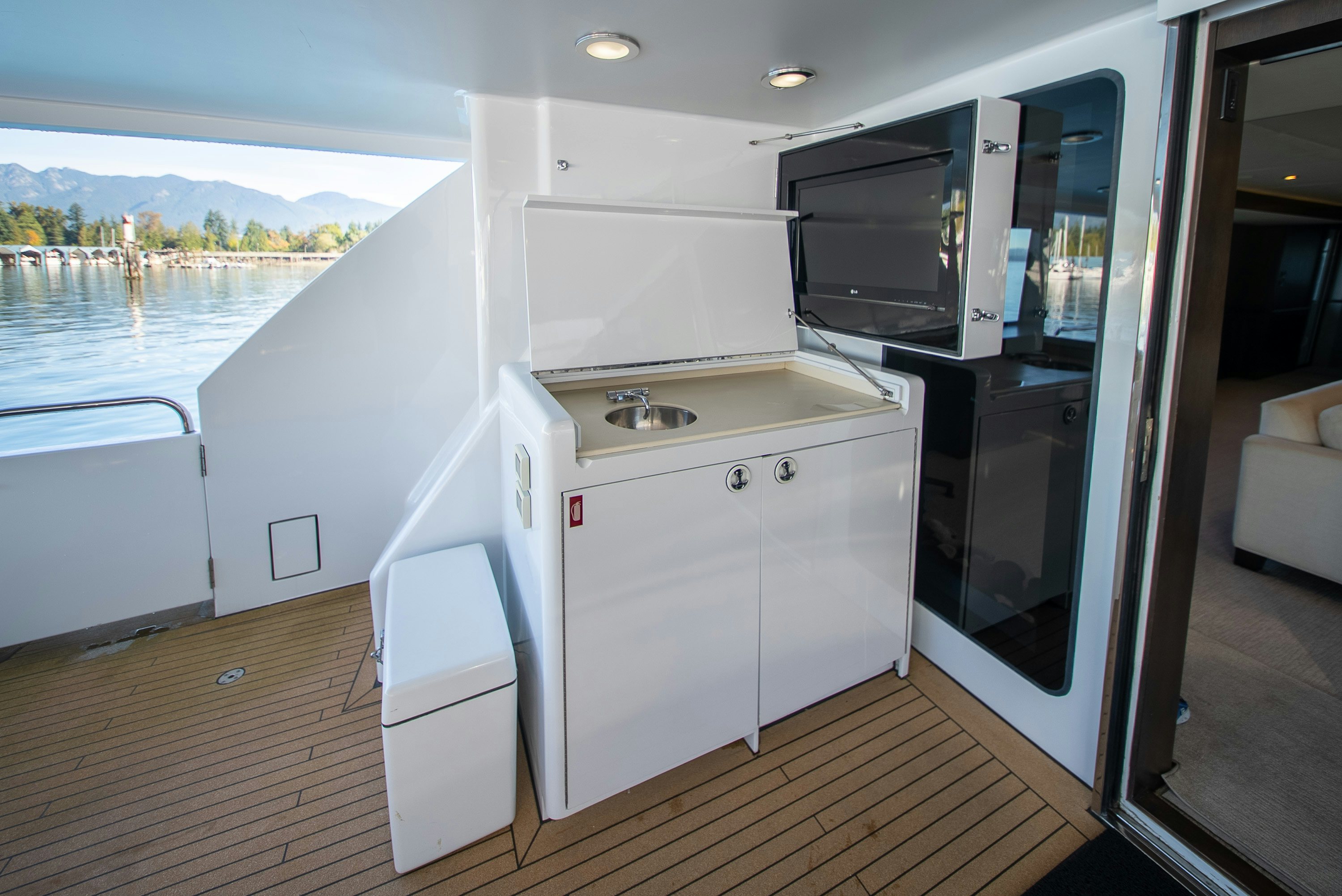 a kitchen with a sink and microwave aboard ENCORE Yacht for Sale