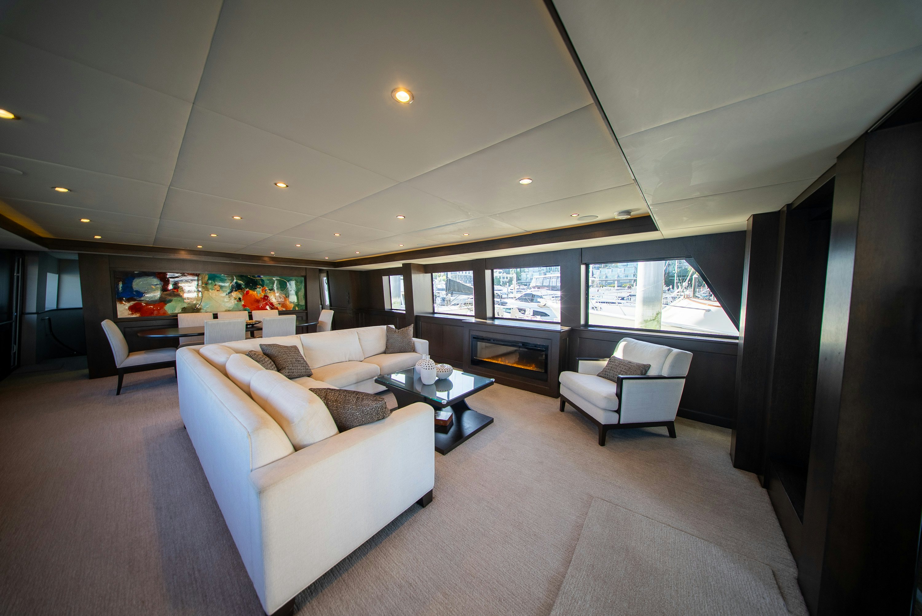 a large living room with a large window aboard ENCORE Yacht for Sale