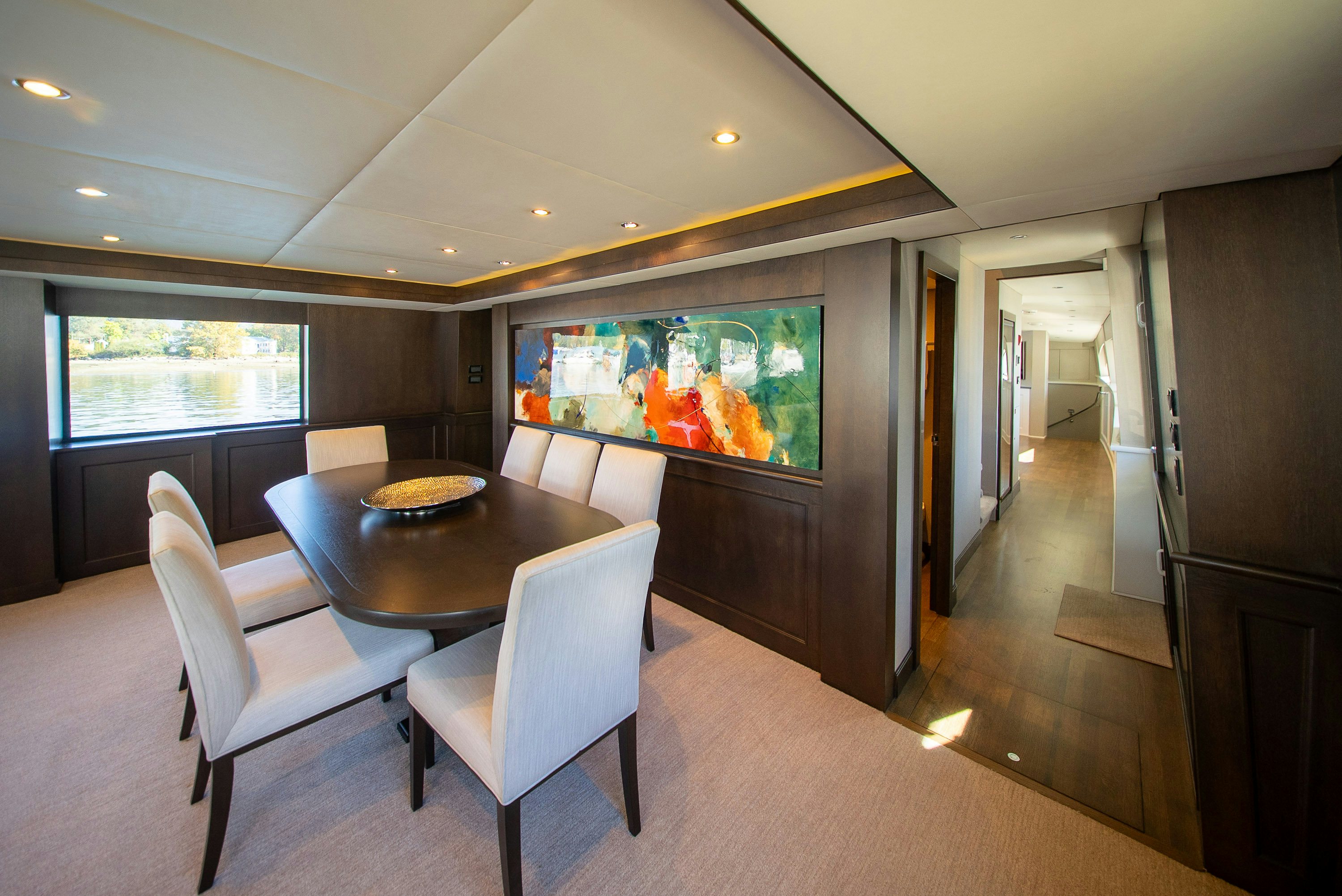 a conference room with a table and chairs aboard ENCORE Yacht for Sale