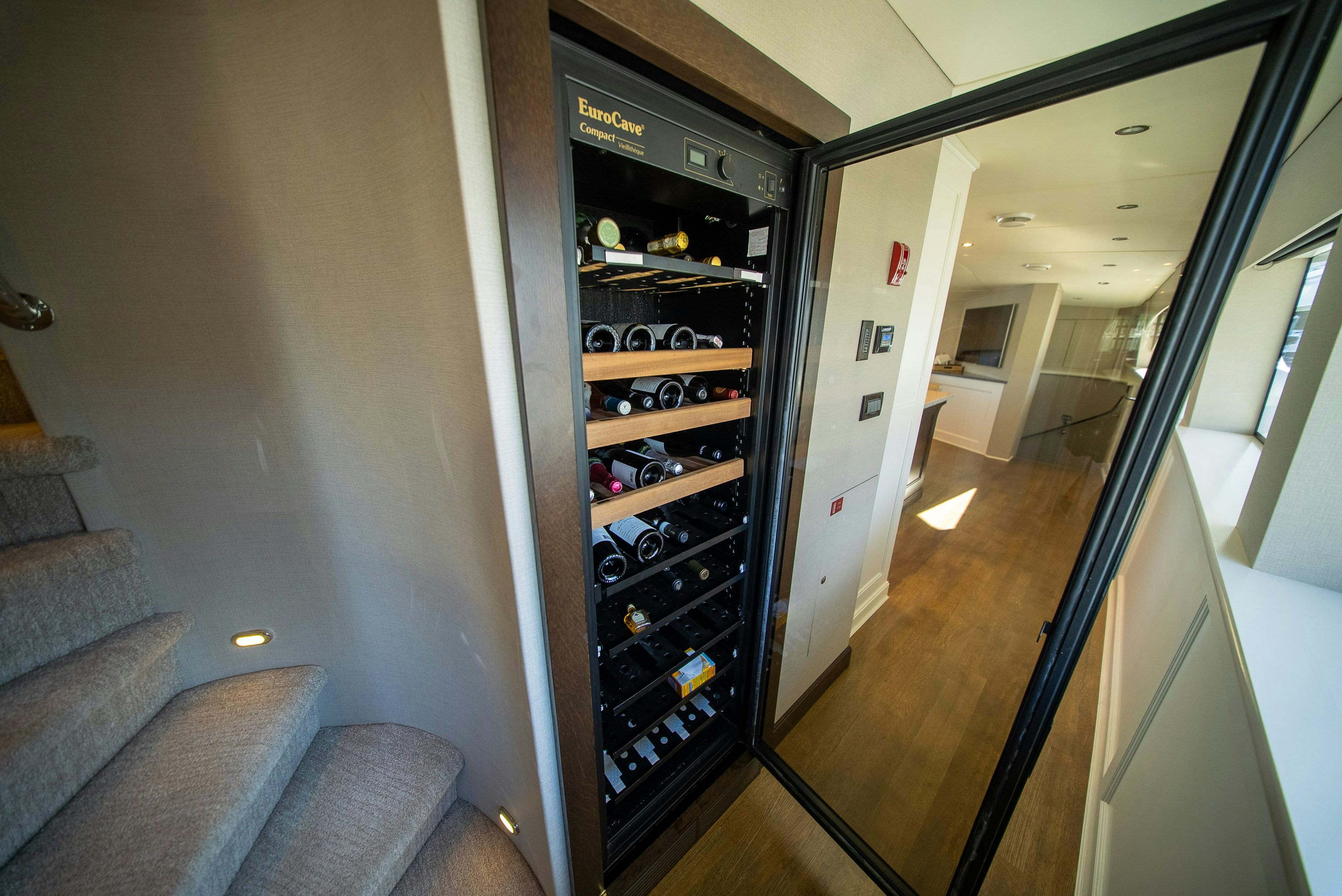 a black cabinet with a door open aboard ENCORE Yacht for Sale