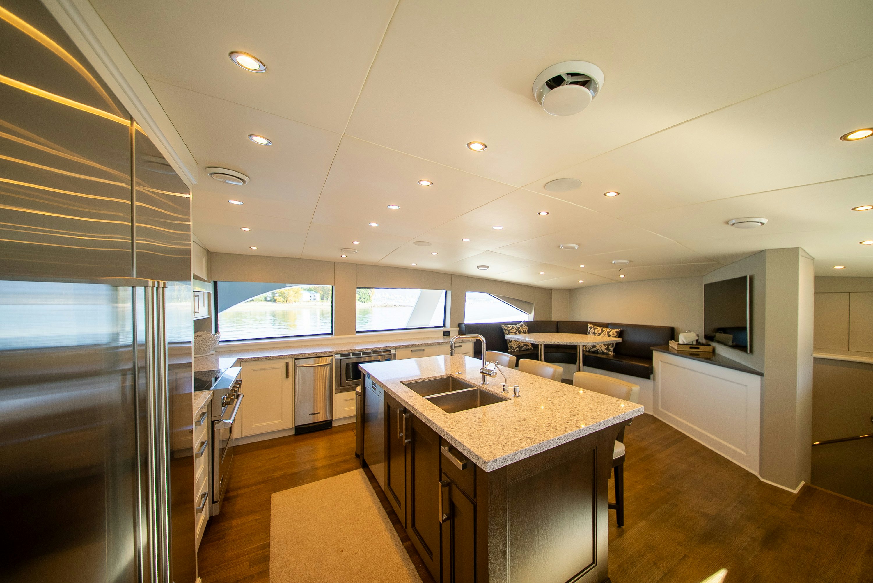 a large kitchen with a large island aboard ENCORE Yacht for Sale