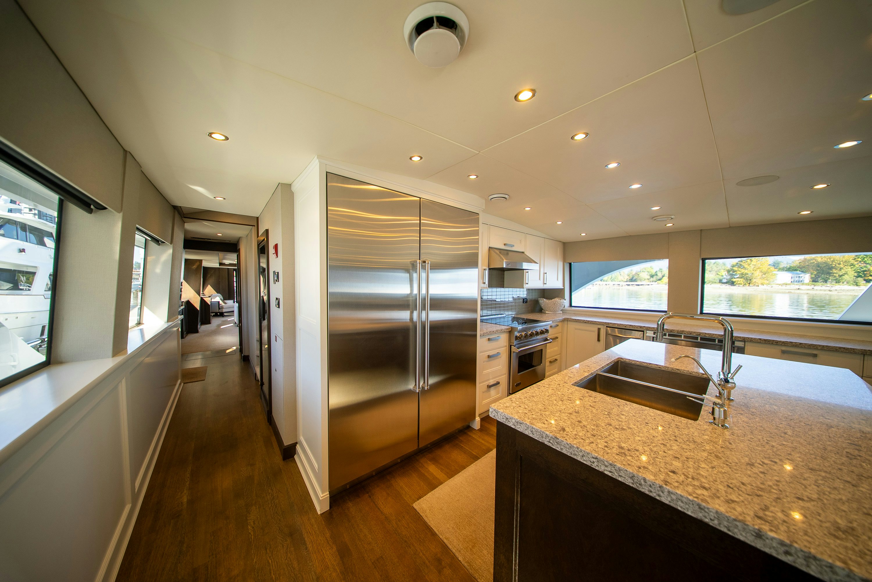 a kitchen with a large glass shower aboard ENCORE Yacht for Sale