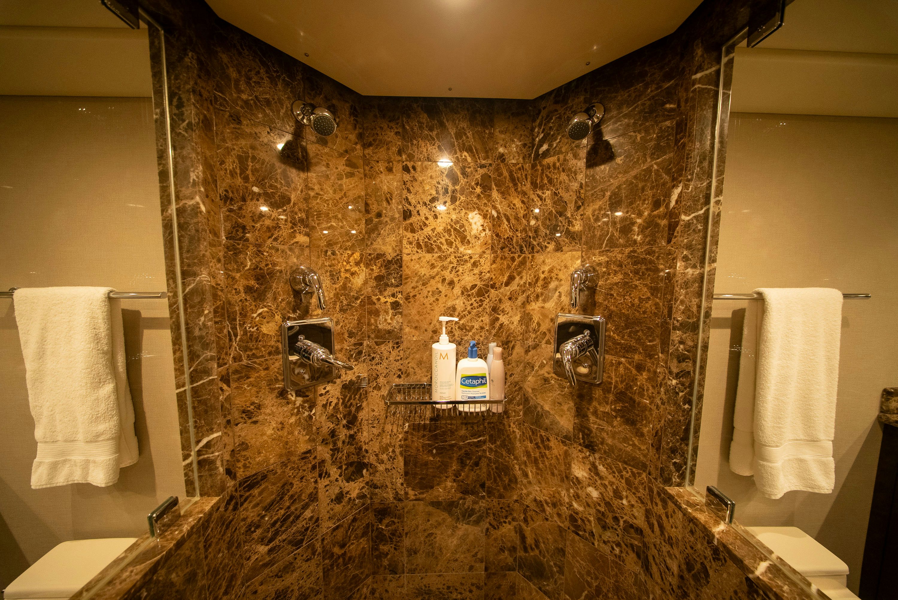 a bathroom with a marble shower aboard ENCORE Yacht for Sale