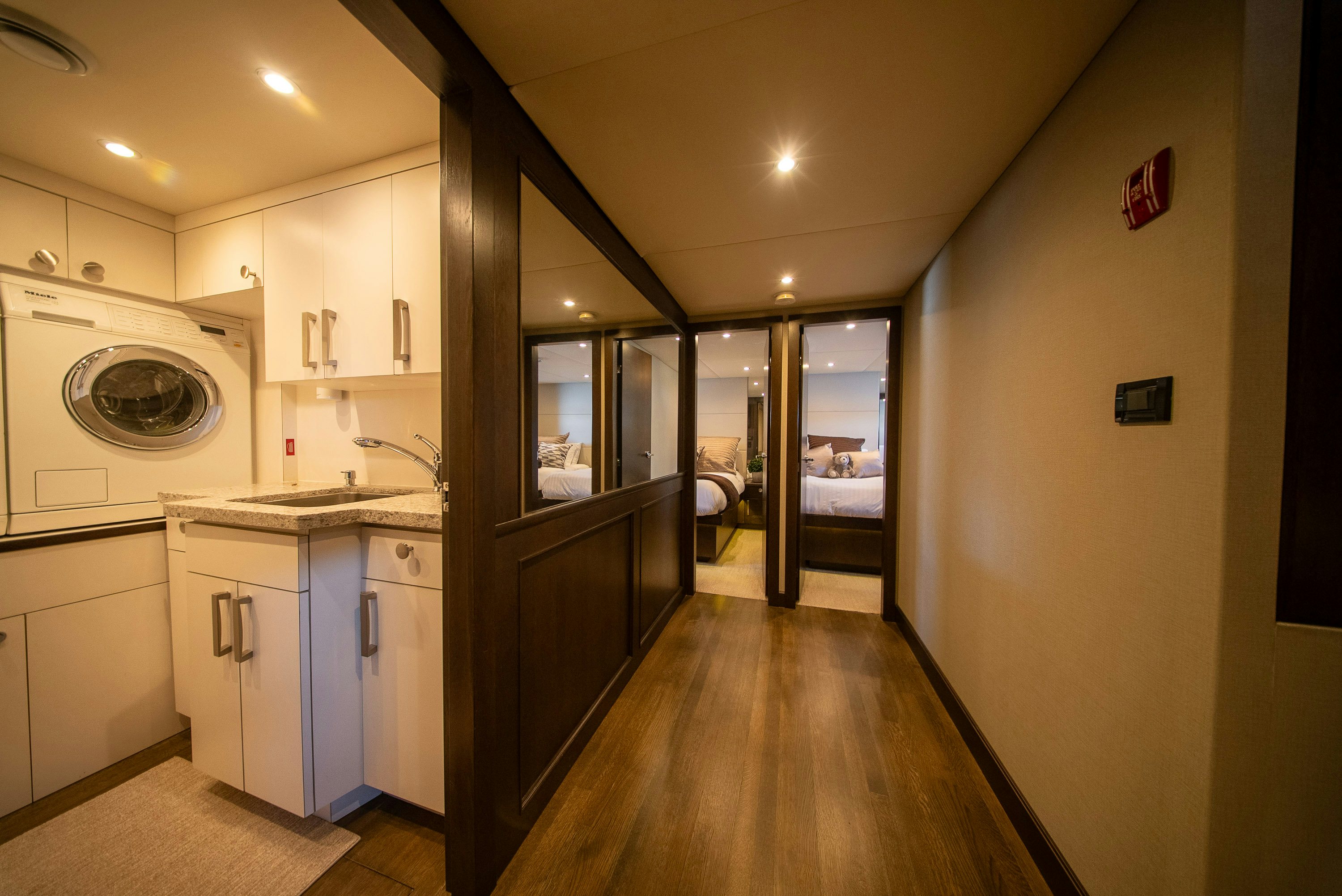 a kitchen with a washing machine aboard ENCORE Yacht for Sale