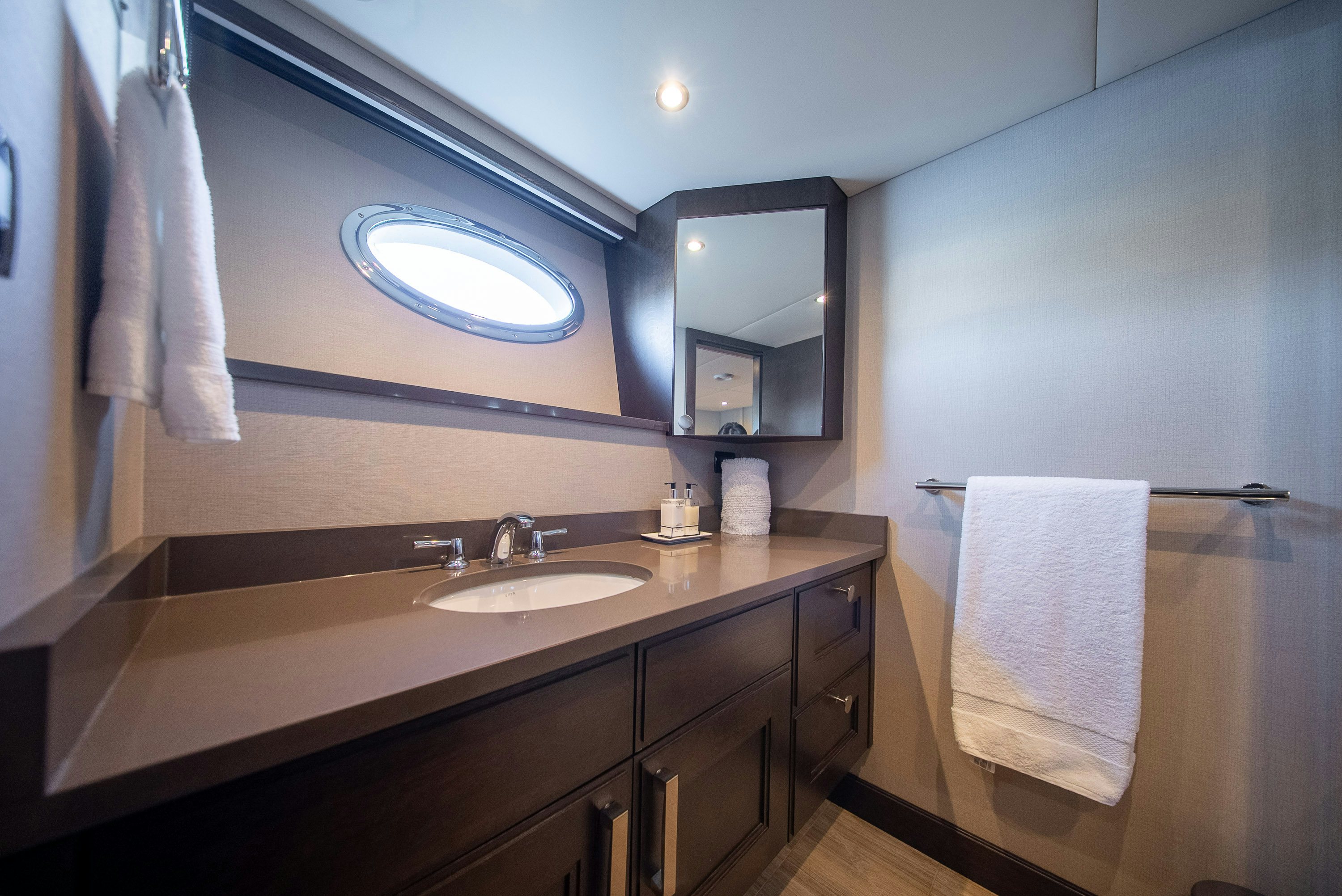 a bathroom with a sink and a mirror aboard ENCORE Yacht for Sale