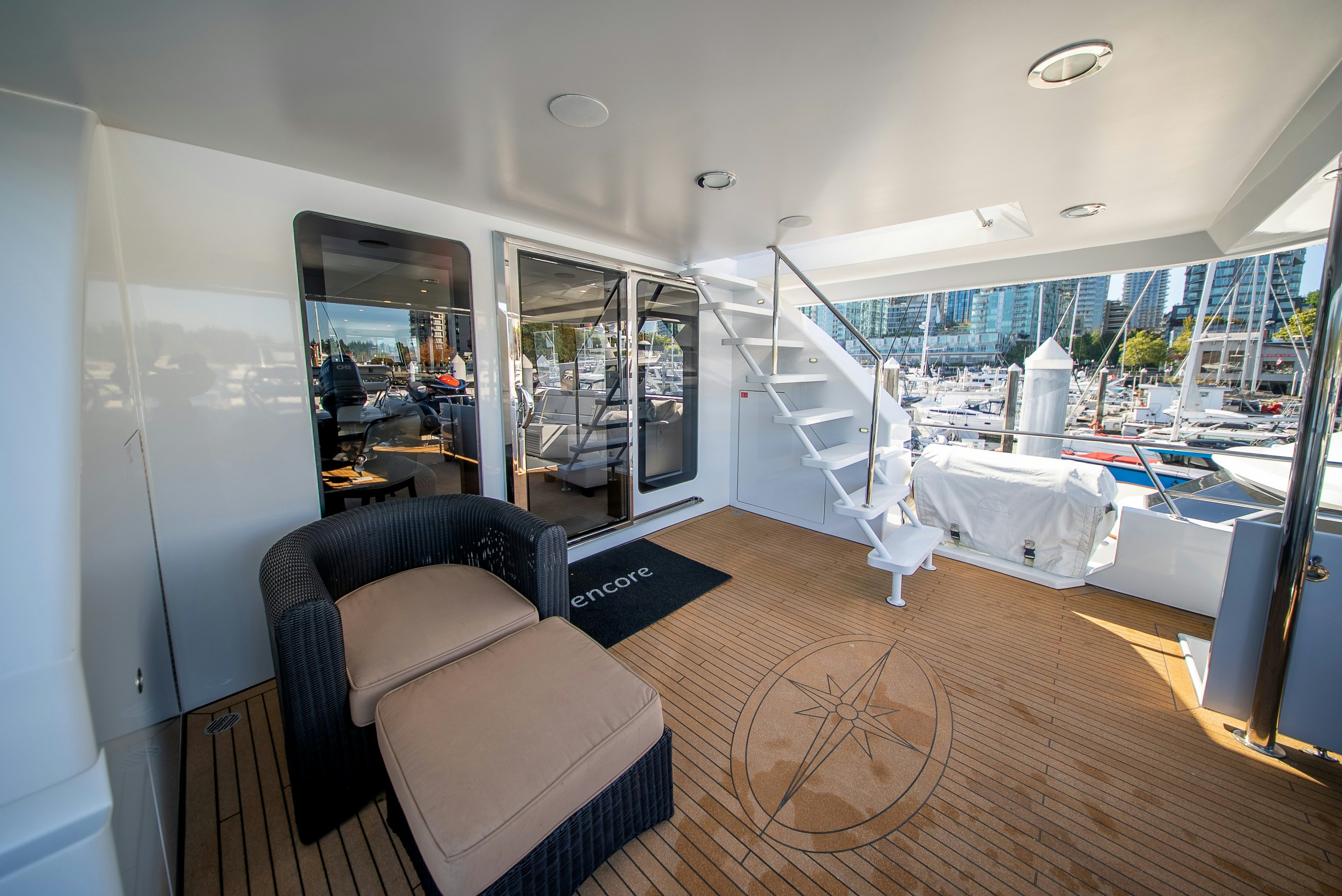 a room with a view of the city and the water aboard ENCORE Yacht for Sale