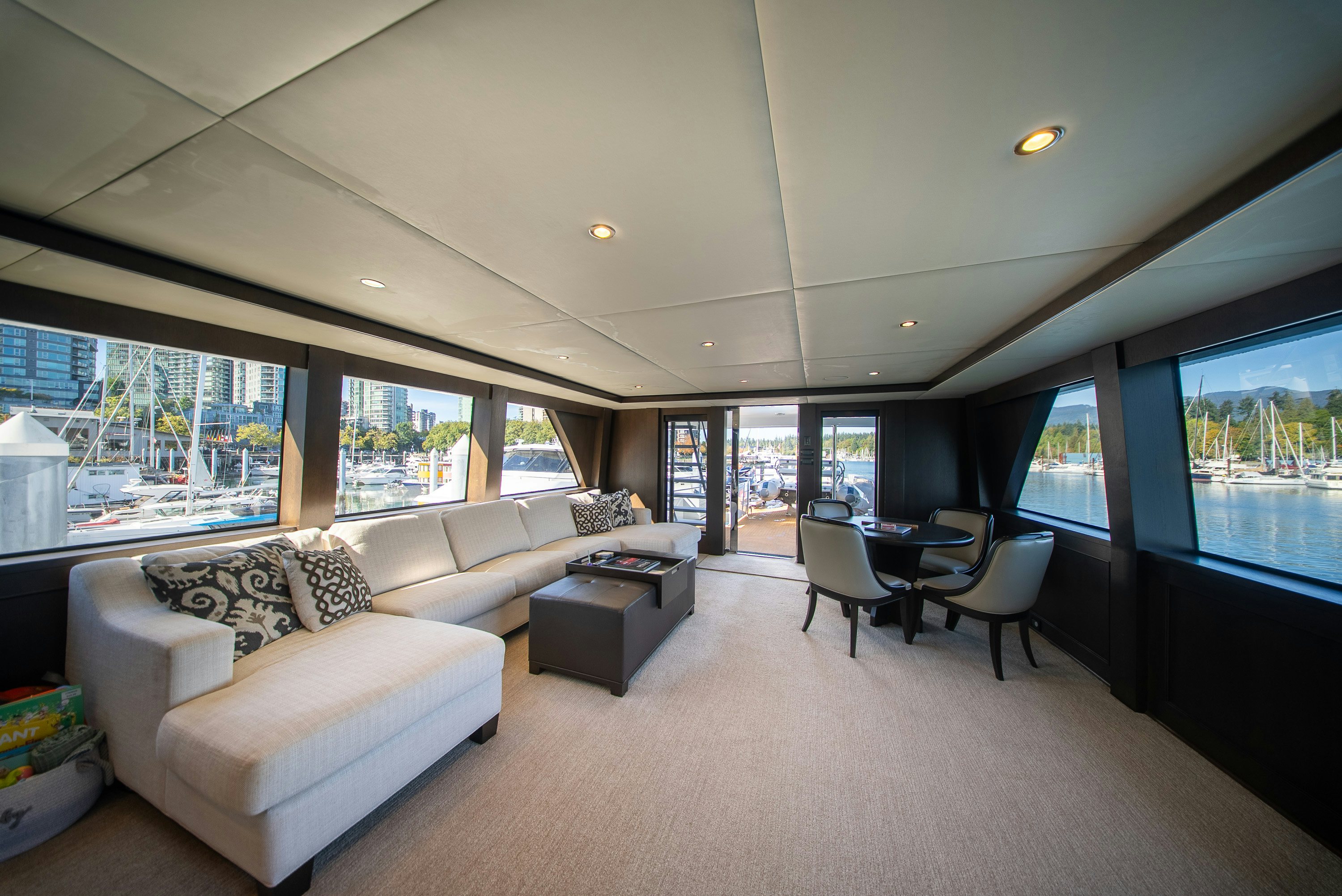 a living room with a large window aboard ENCORE Yacht for Sale