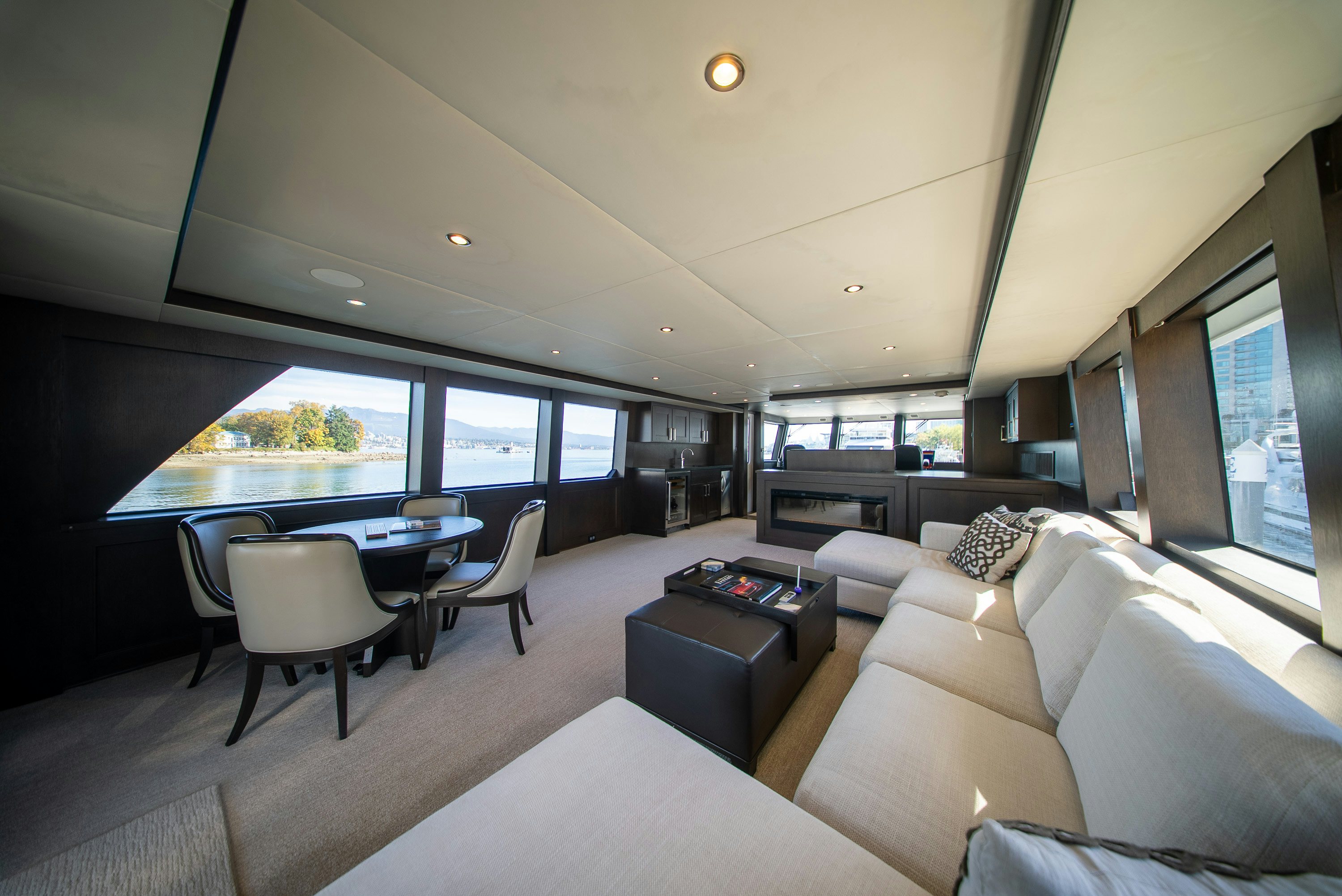 a living room with a large window aboard ENCORE Yacht for Sale