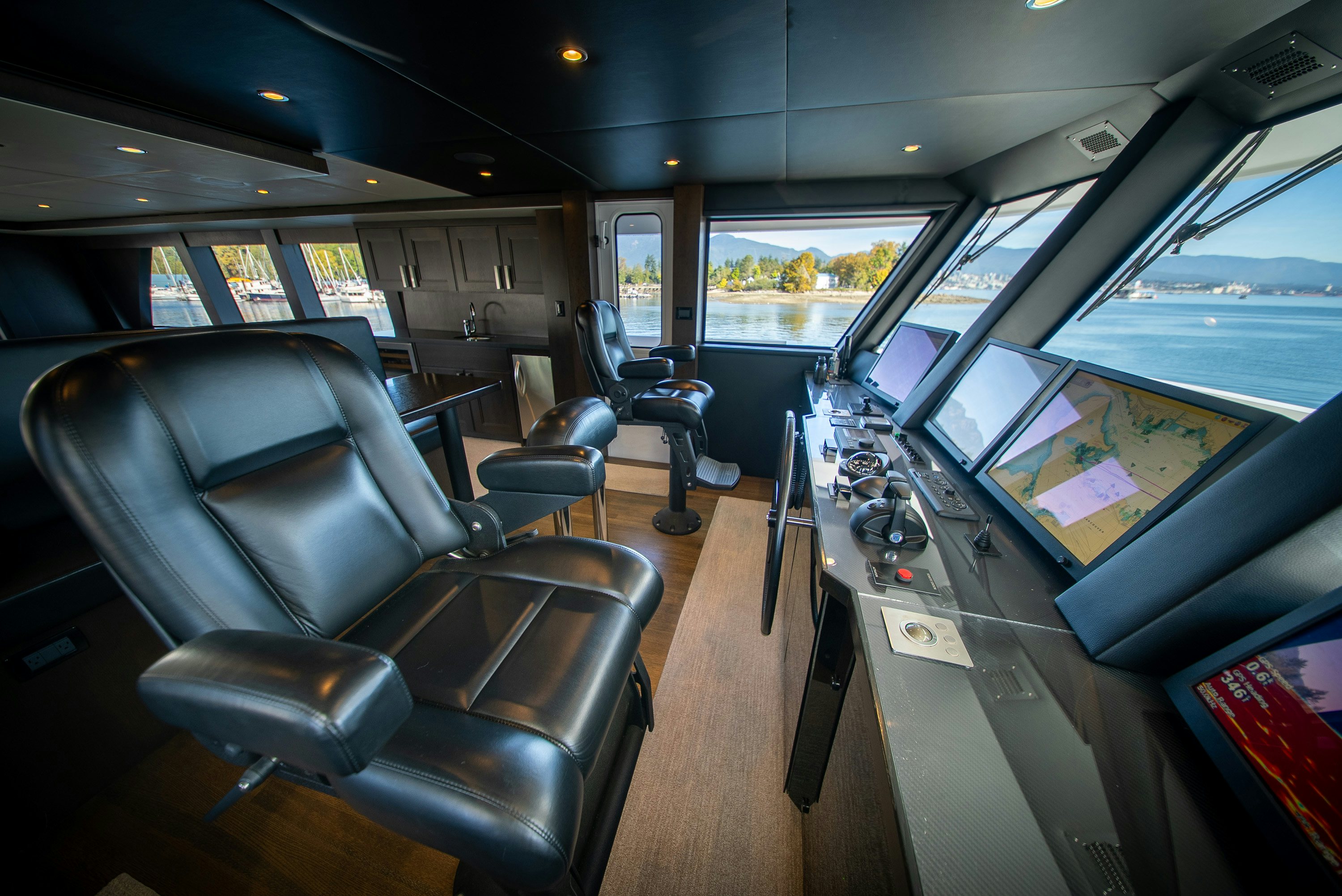 inside of a vehicle with a view of the trees and the forest aboard ENCORE Yacht for Sale