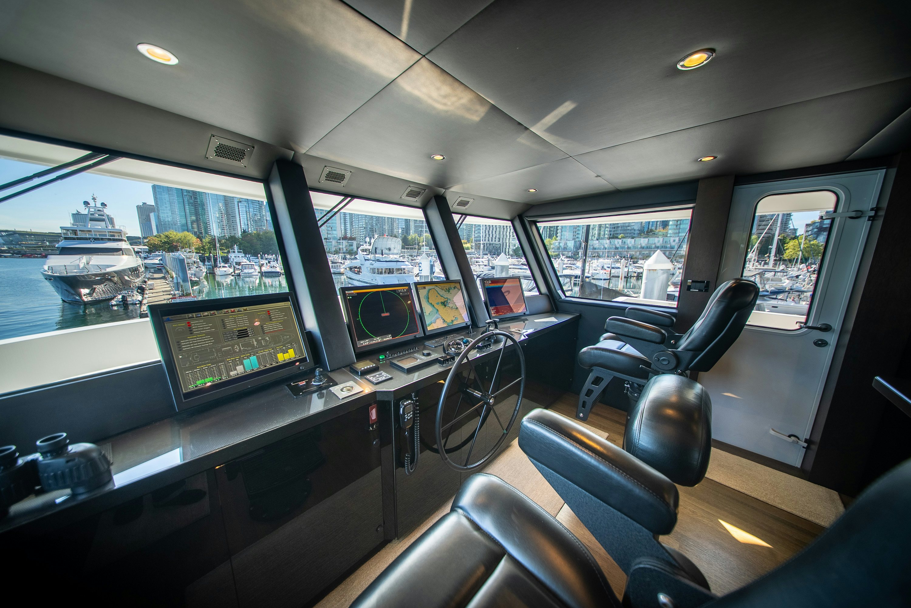 inside of a vehicle with many monitors and screens aboard ENCORE Yacht for Sale
