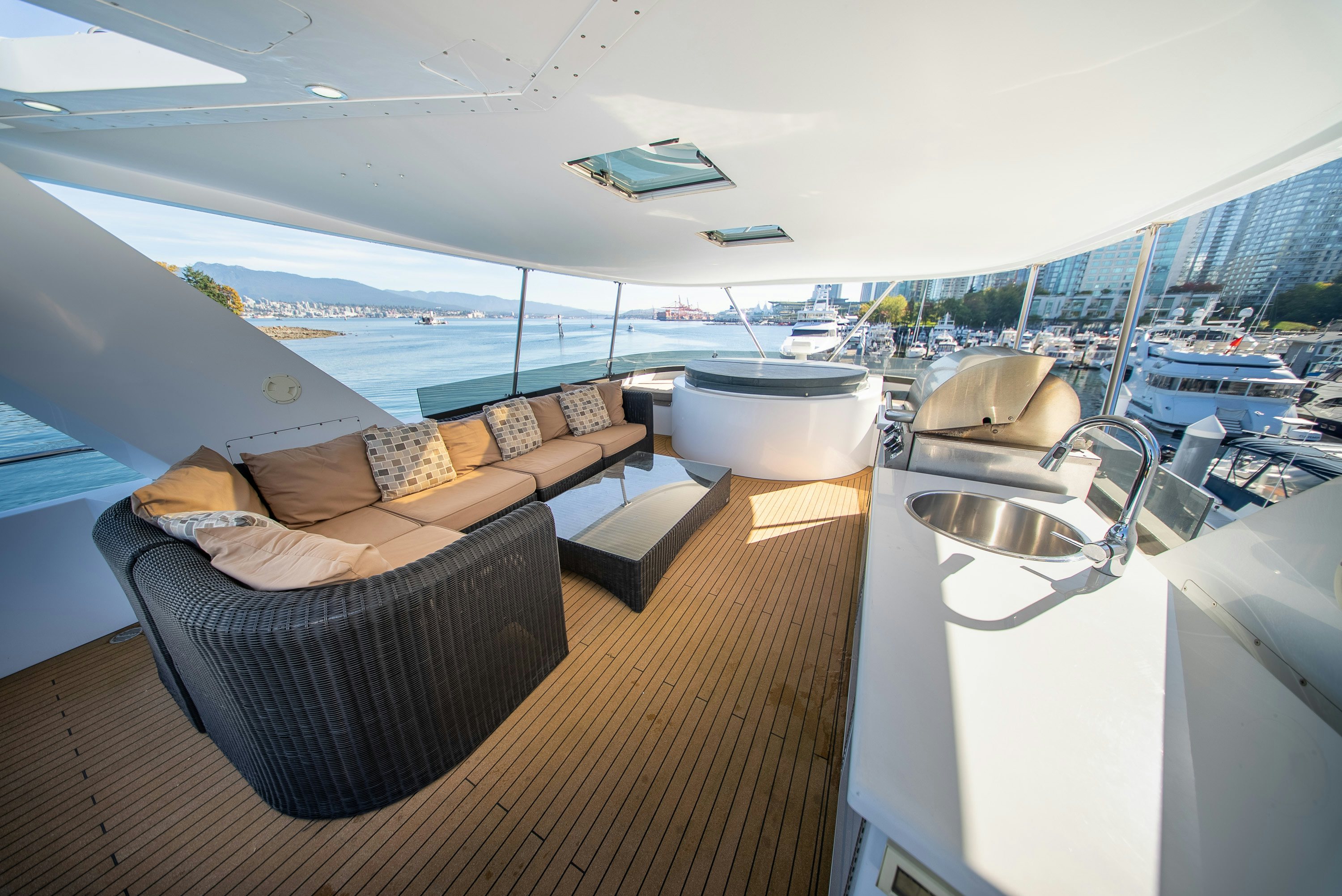 a room with a bed and a sink aboard ENCORE Yacht for Sale
