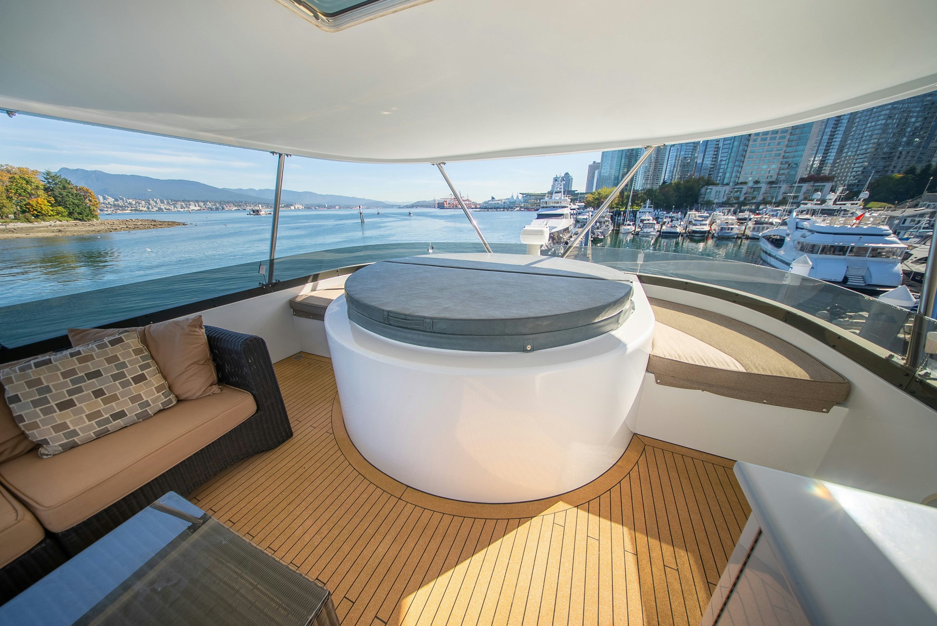 a large white tub on a deck overlooking a body of water aboard ENCORE Yacht for Sale