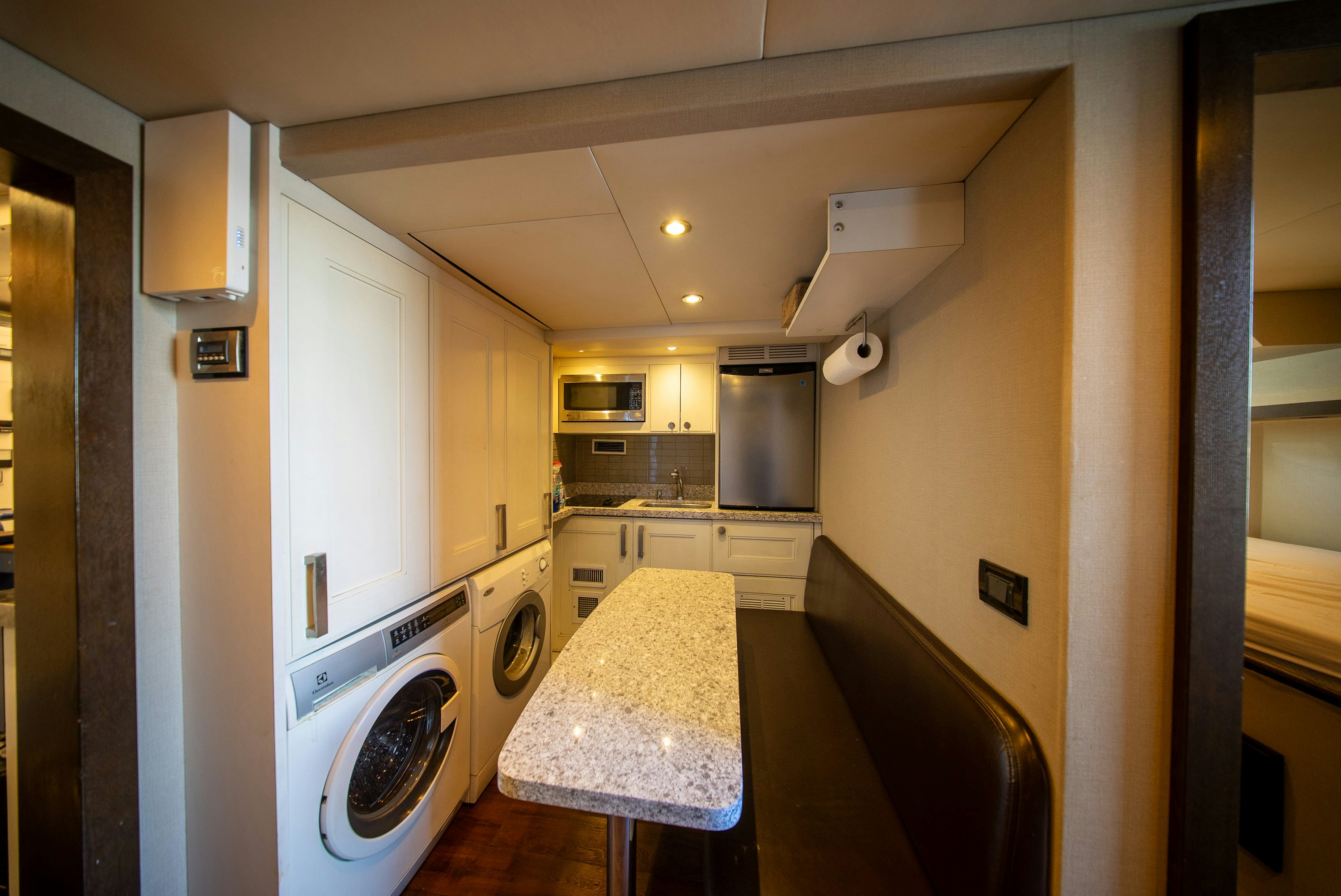 a kitchen with a washing machine aboard ENCORE Yacht for Sale