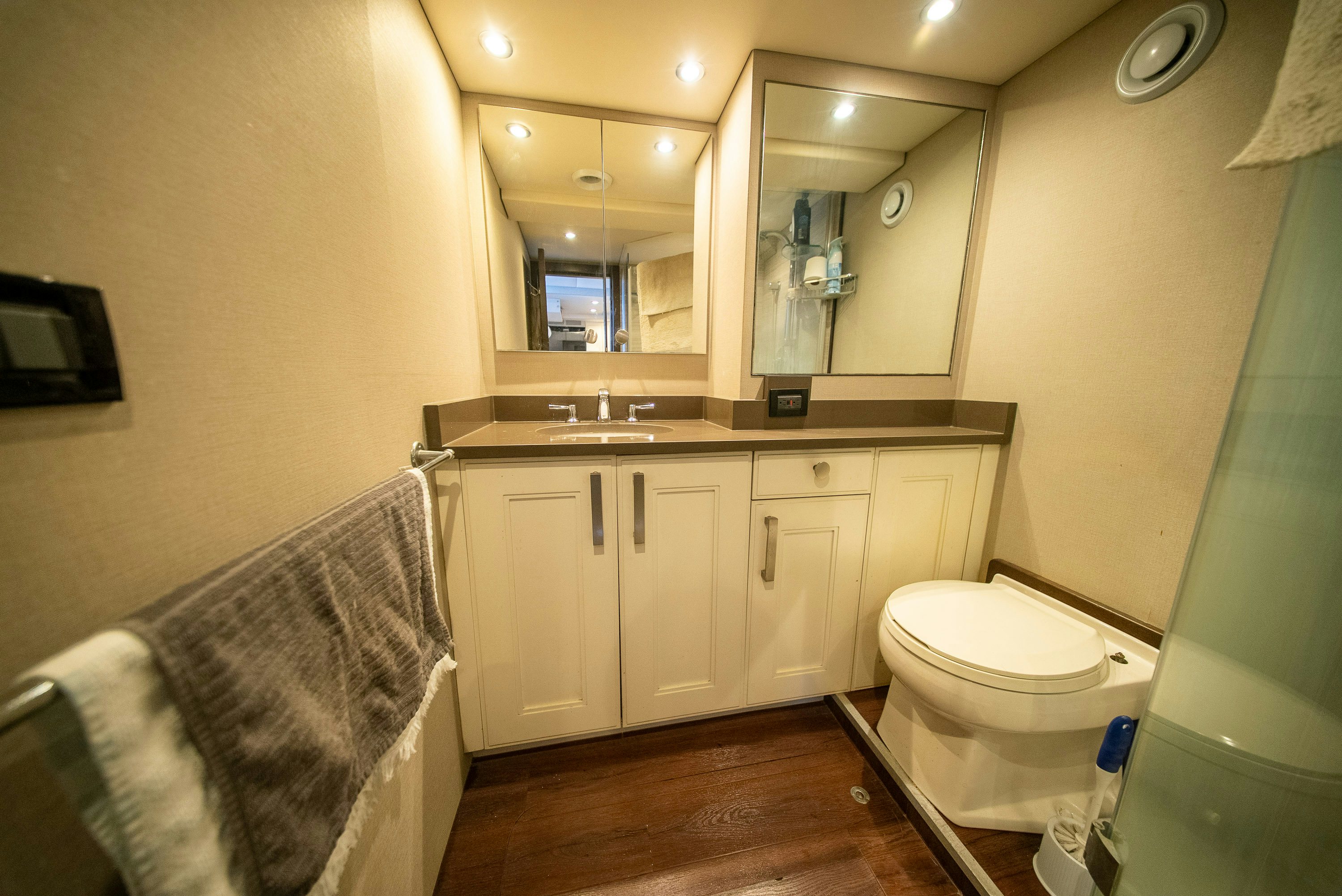 a bathroom with a sink toilet and a mirror aboard ENCORE Yacht for Sale