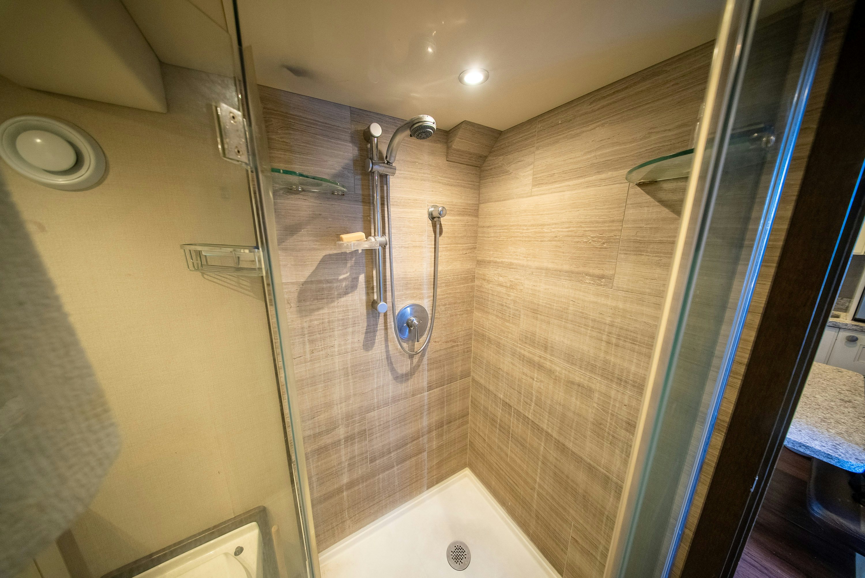a bathroom with a glass shower aboard ENCORE Yacht for Sale