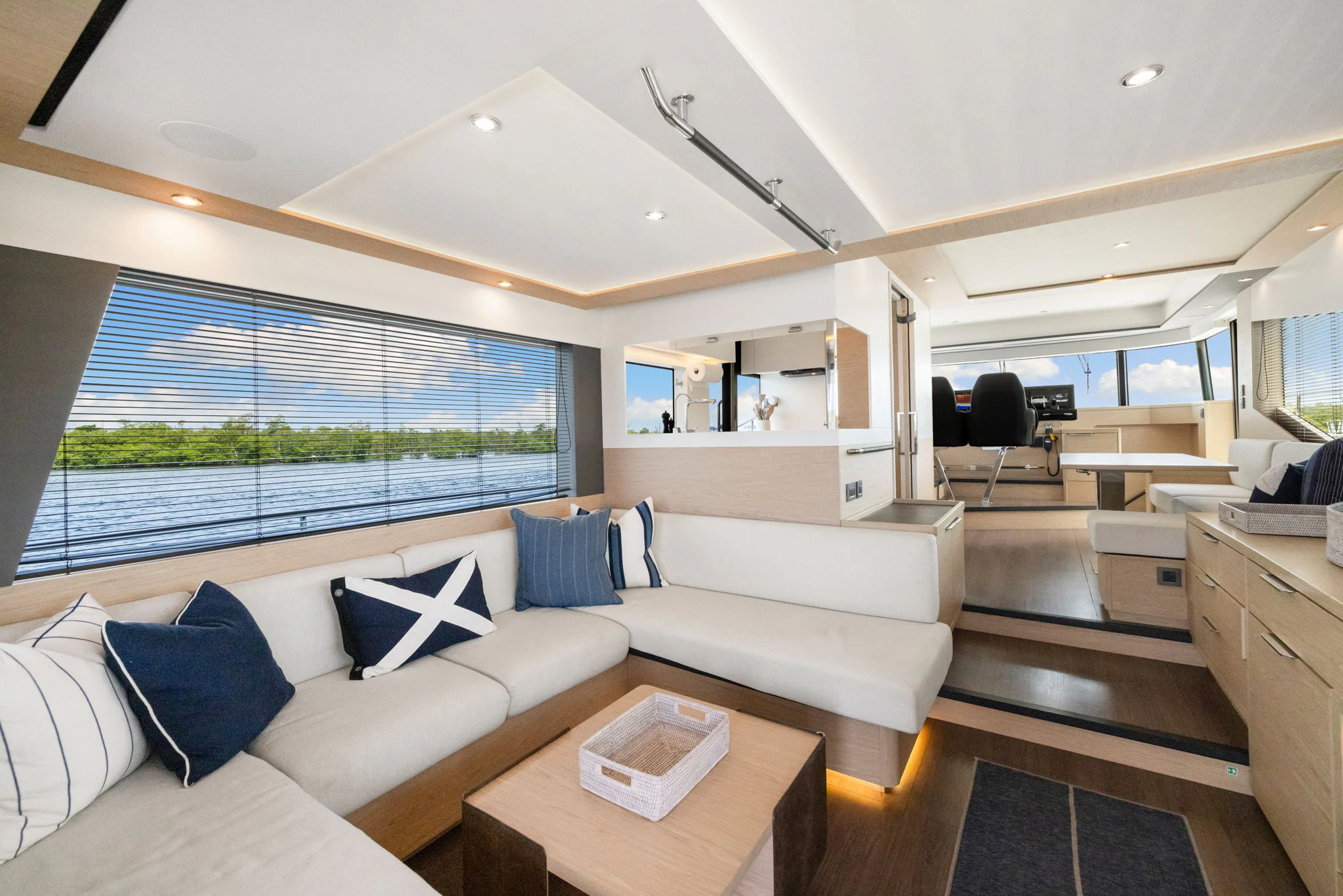 a living room with a large window aboard ABIDE AWHILE Yacht for Sale