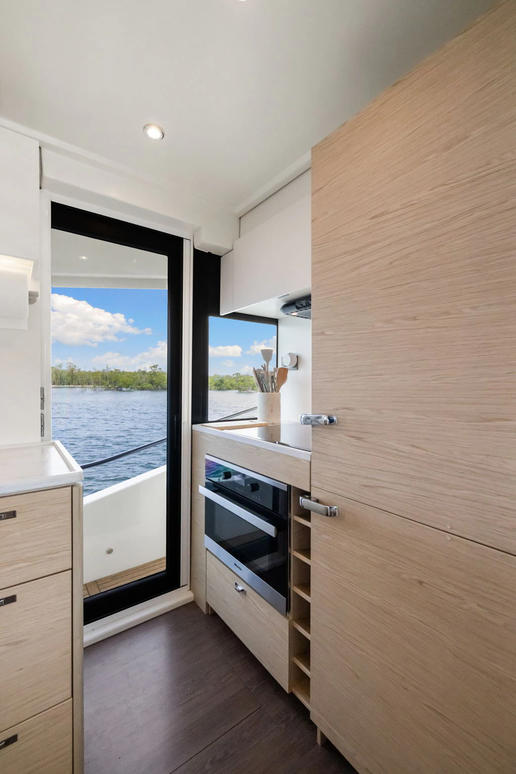a kitchen with a sliding door aboard ABIDE AWHILE Yacht for Sale