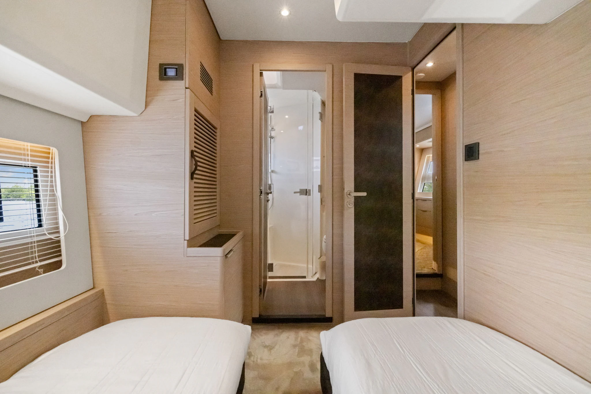 a room with a bed and a door aboard ABIDE AWHILE Yacht for Sale