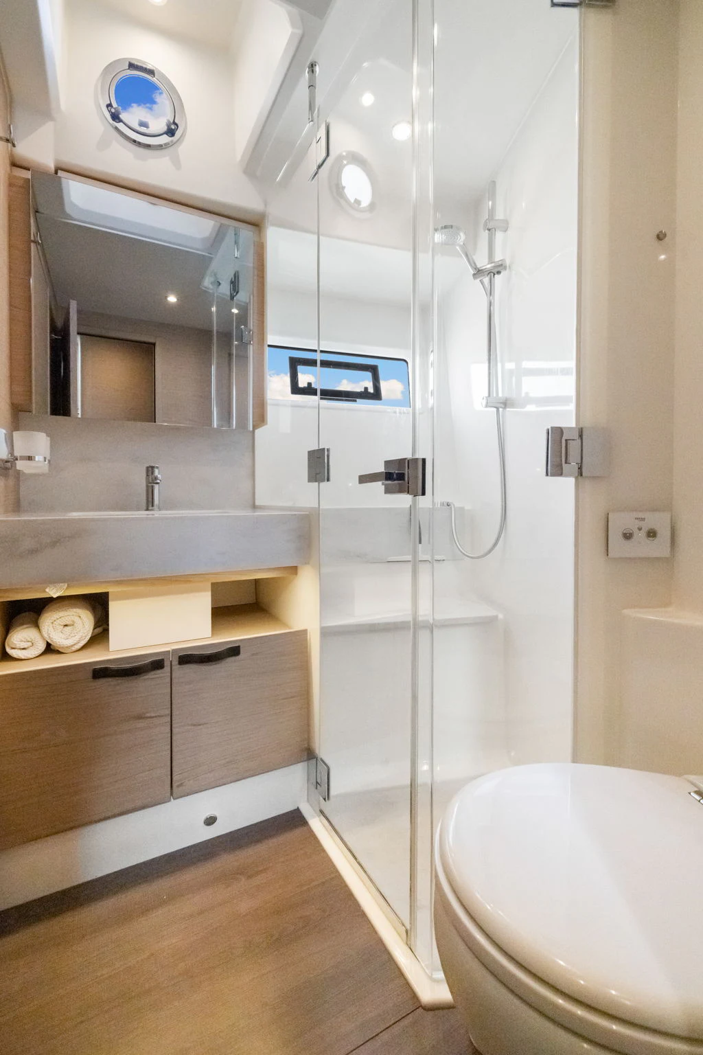 a bathroom with a glass shower aboard ABIDE AWHILE Yacht for Sale