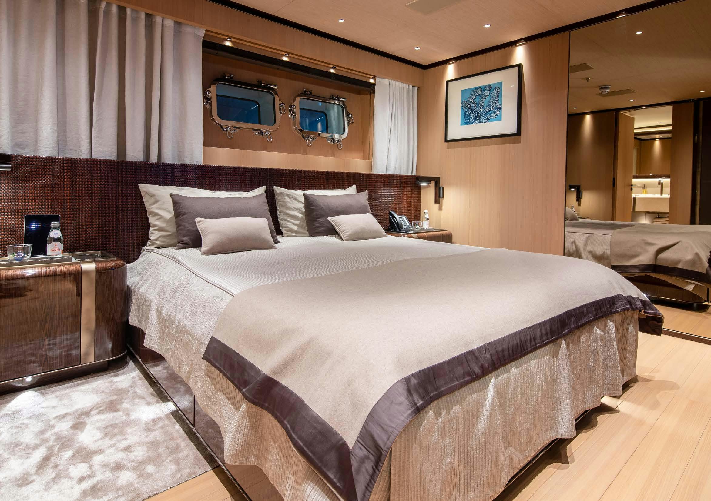 a bed with a white sheet aboard VERTIGE Yacht for Sale