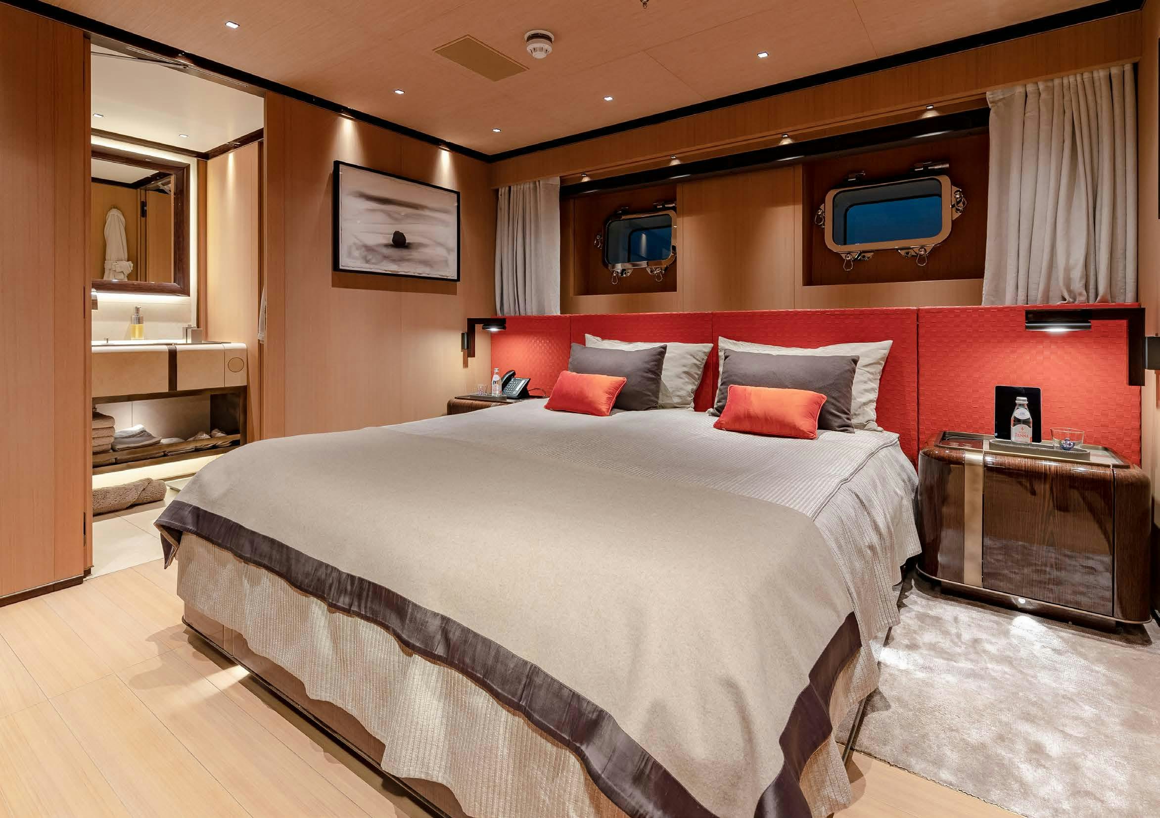 a large bed in a hotel room aboard VERTIGE Yacht for Sale
