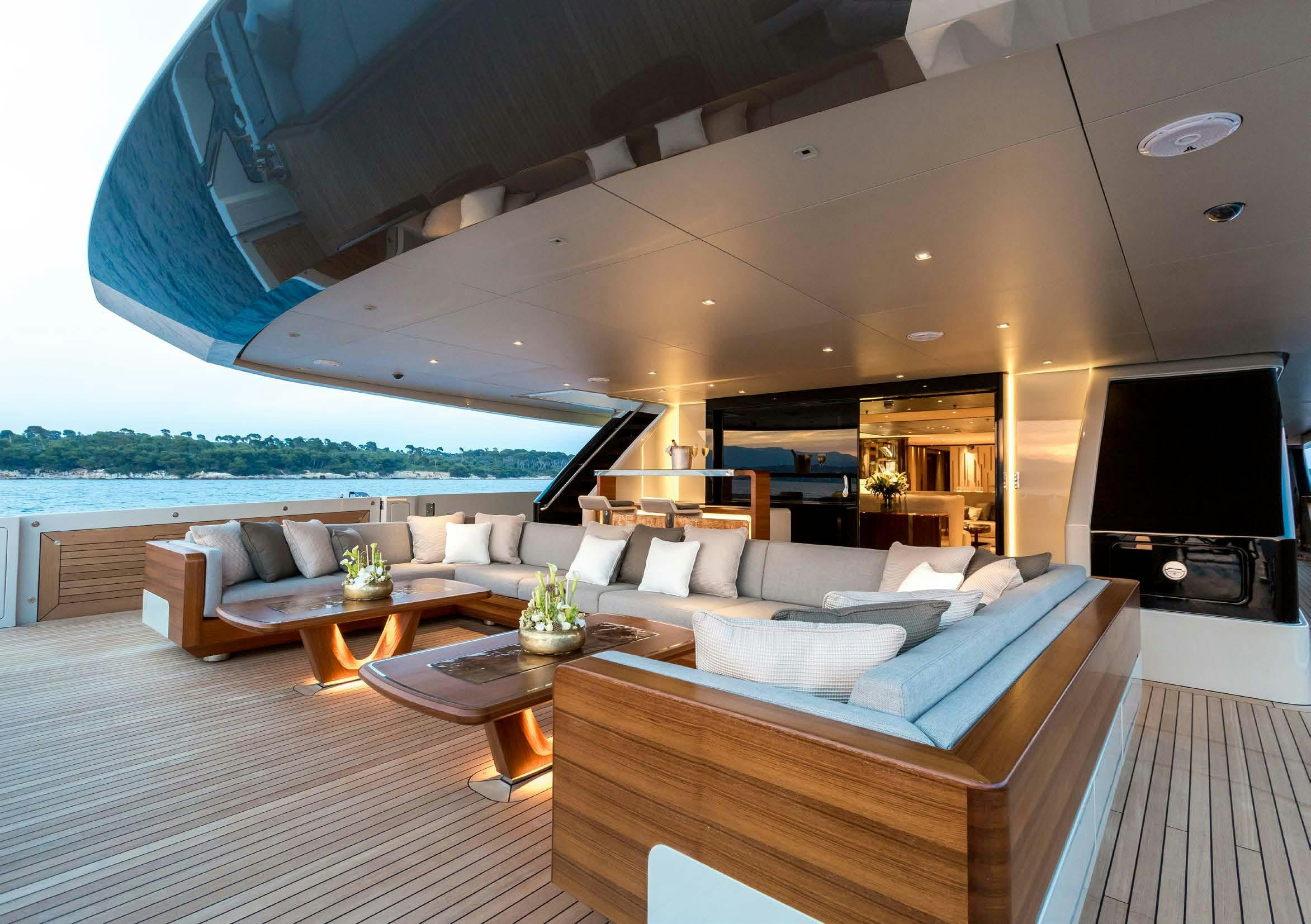 a living room with a large sofa aboard VERTIGE Yacht for Sale