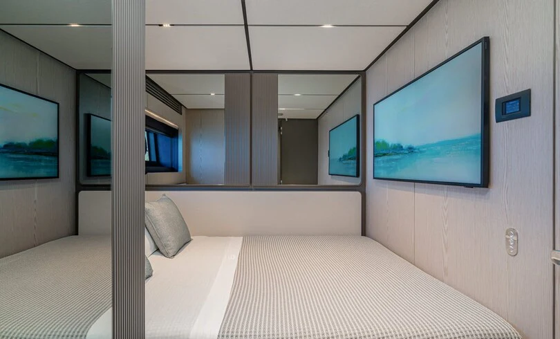 a bed in a room aboard TRILOGY Yacht for Charter