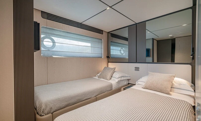 a room with two beds aboard TRILOGY Yacht for Charter