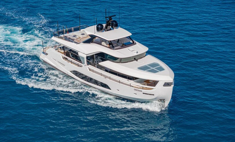a white yacht on the water aboard TRILOGY Yacht for Charter