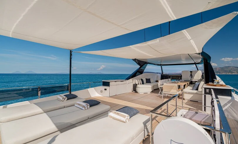 a boat with white furniture aboard TRILOGY Yacht for Charter