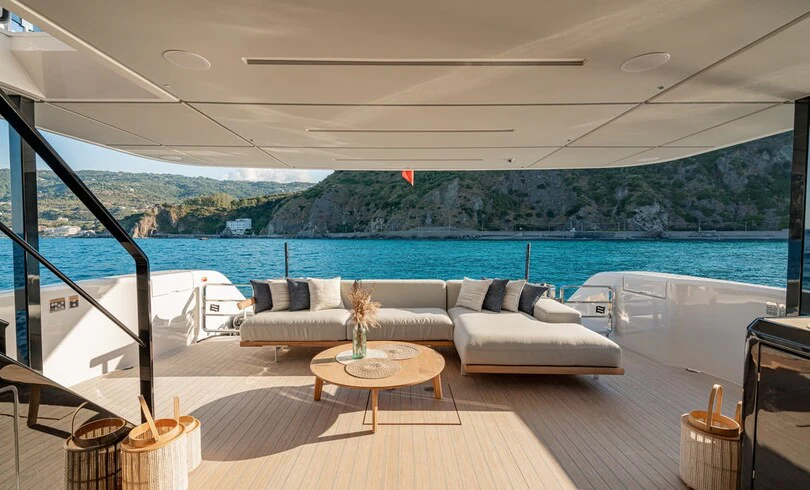 a living room with a large body of water aboard TRILOGY Yacht for Charter