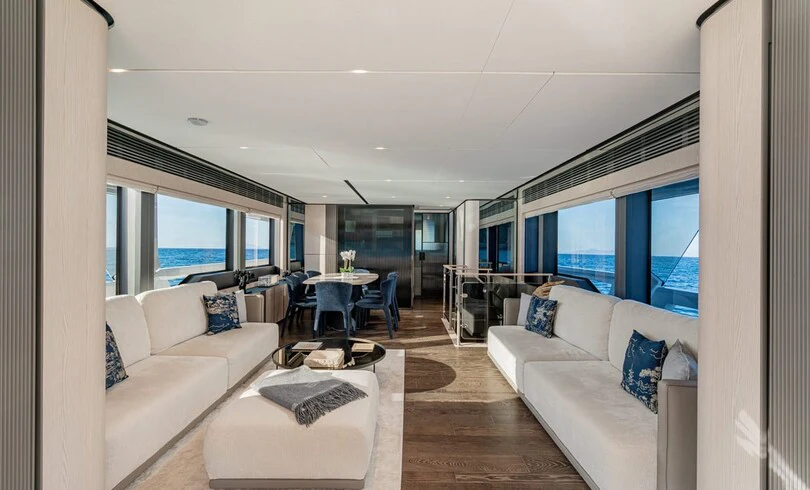 a living room with a large window aboard TRILOGY Yacht for Charter