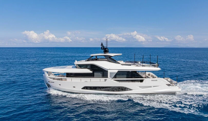 a white boat in the water aboard TRILOGY Yacht for Charter