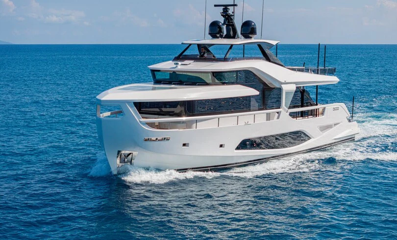 a white yacht in the water aboard TRILOGY Yacht for Charter