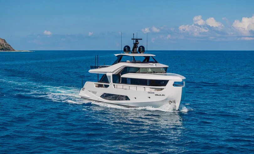 a white boat in the water aboard TRILOGY Yacht for Charter