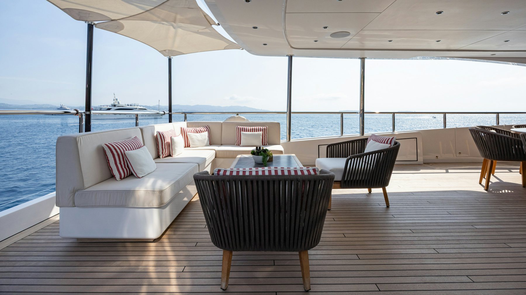 a room with a table and chairs aboard BELLA VITA Yacht for Sale